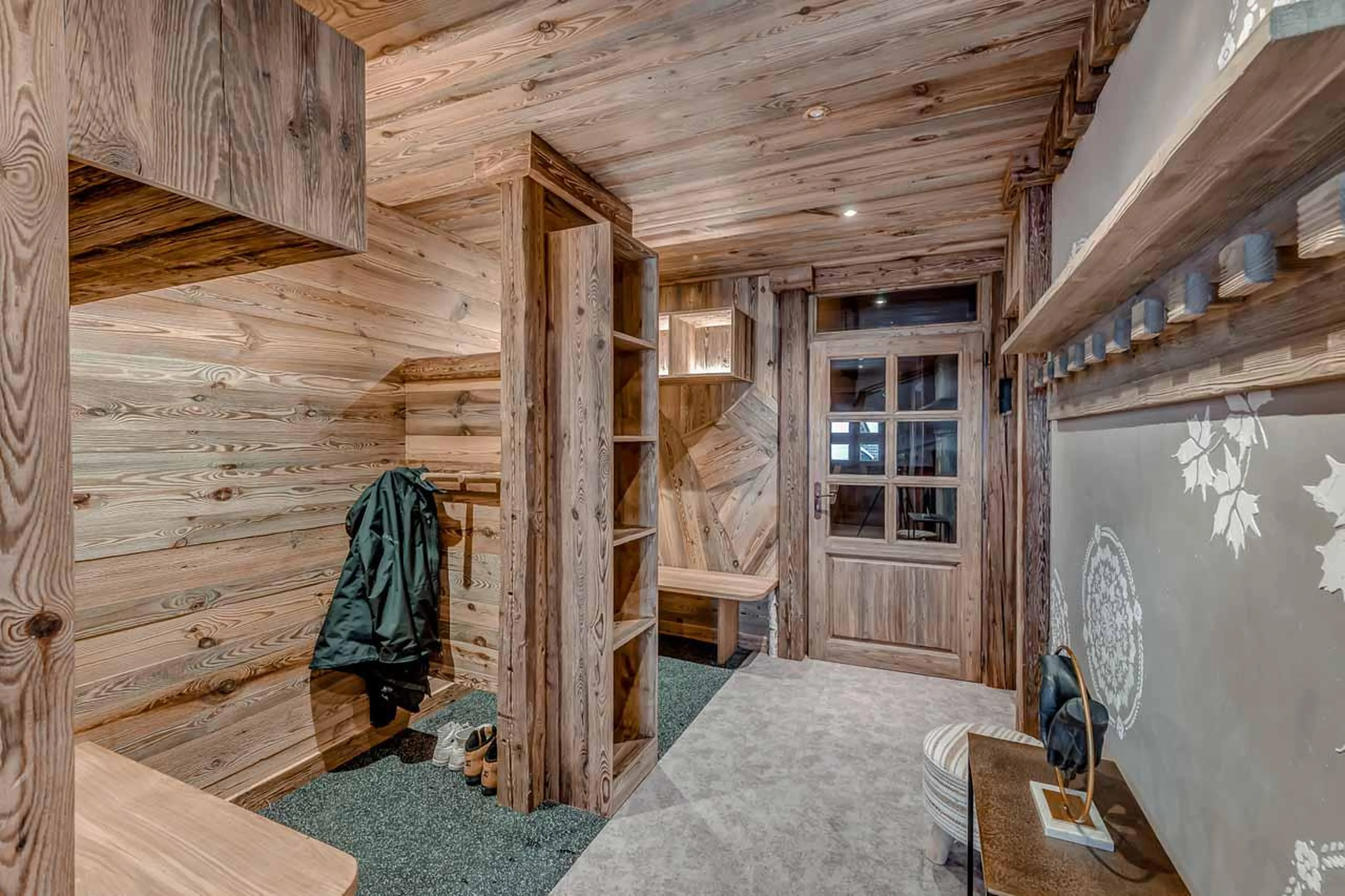 Spacious entrance area with ski storage at Chalet Macha in Tignes