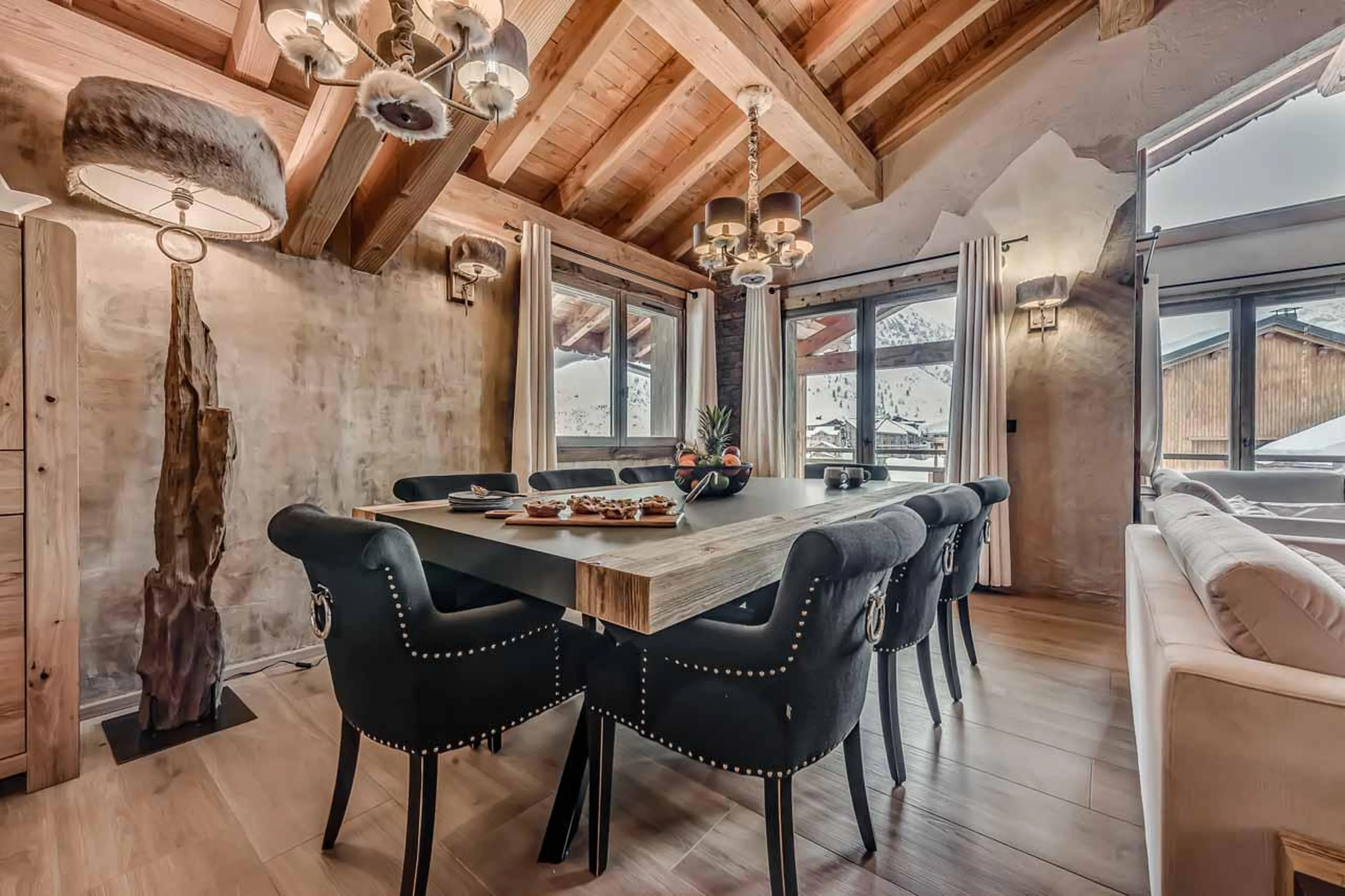 Modern dining area with table and chairs at Chalet Macha in Tignes
