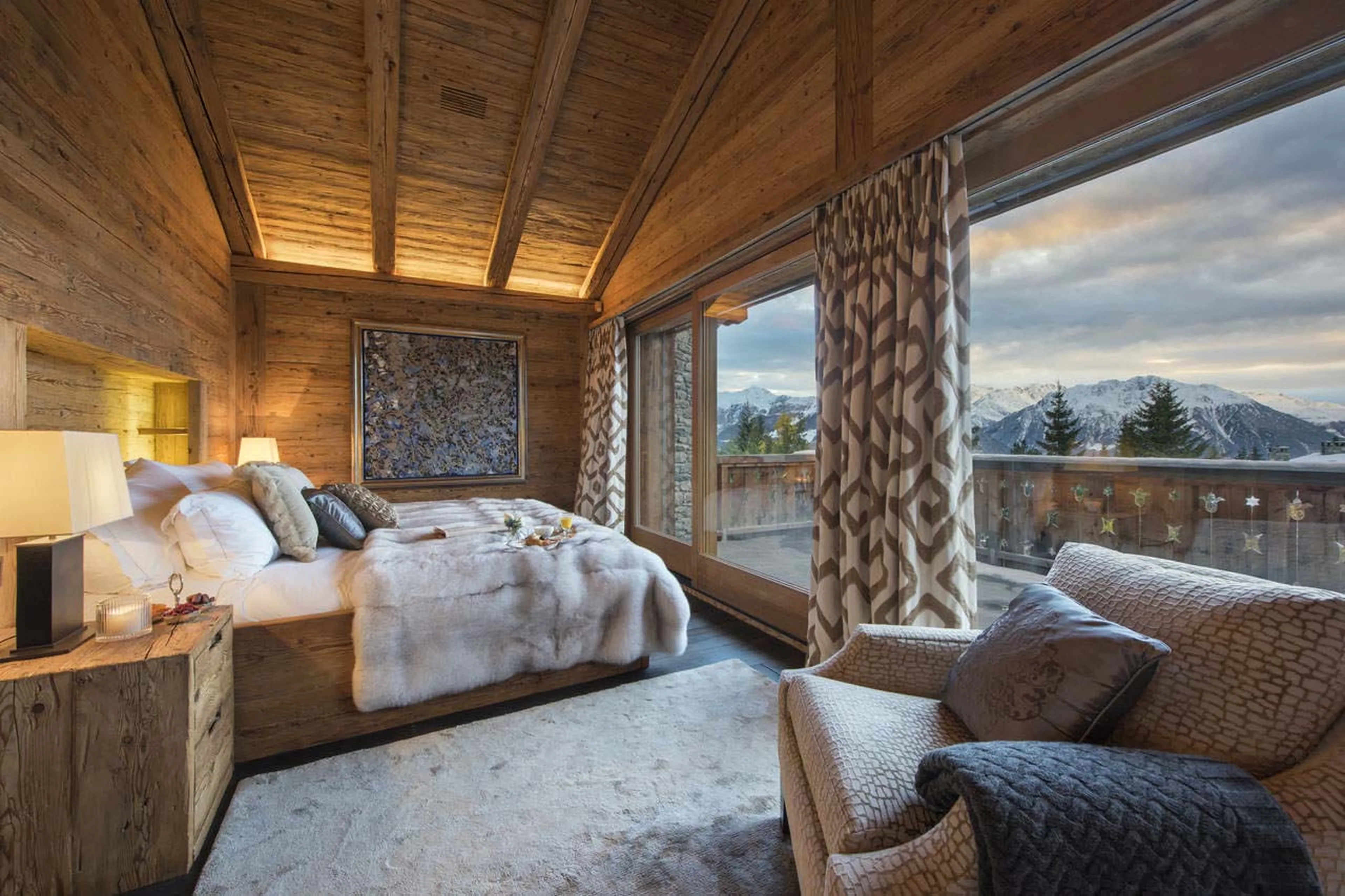 Master bedroom with mountain view at Chalet Makini in Verbier
