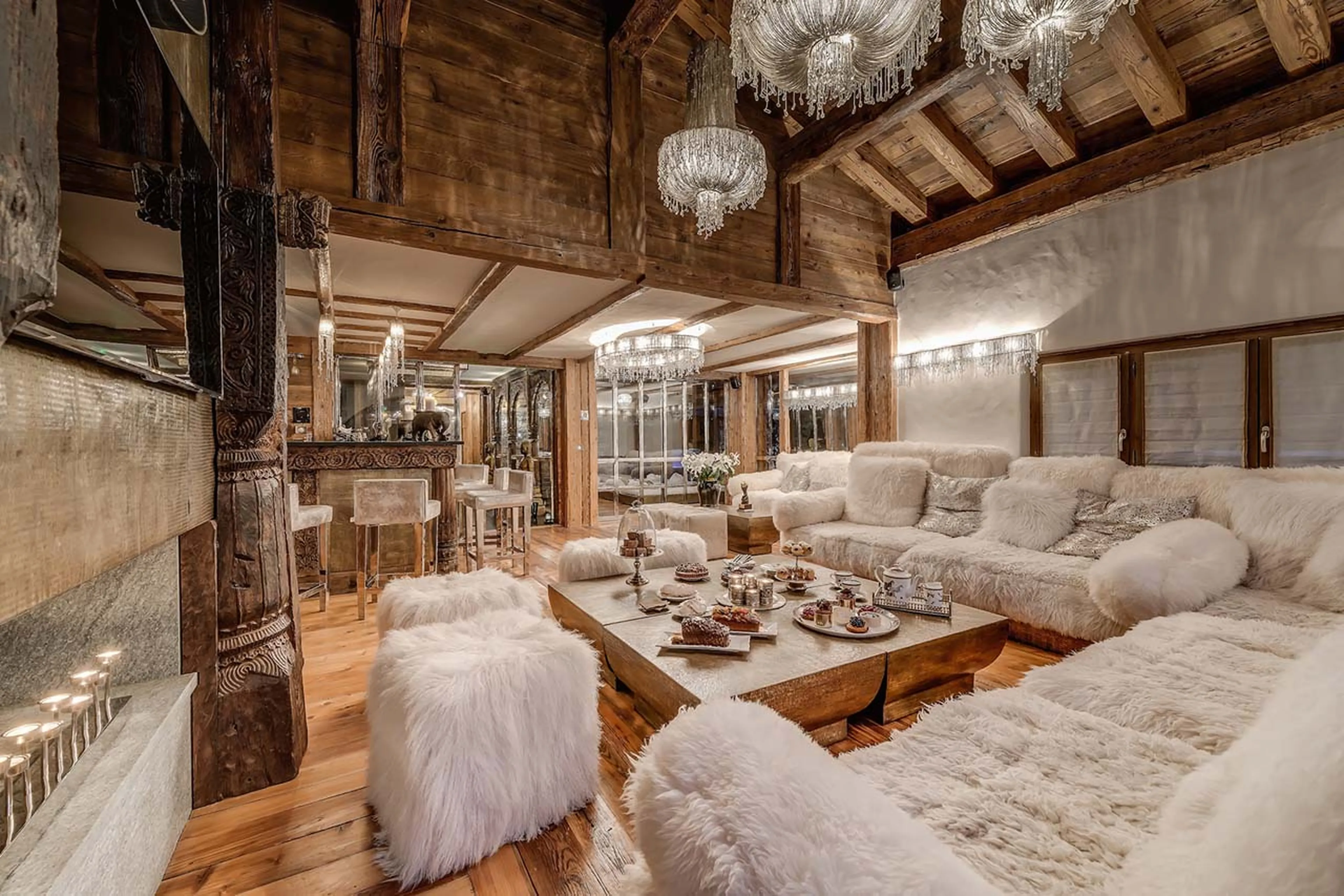Entertainment area with bar and fire place in Chalet Marco Polo in Val d’ Isere