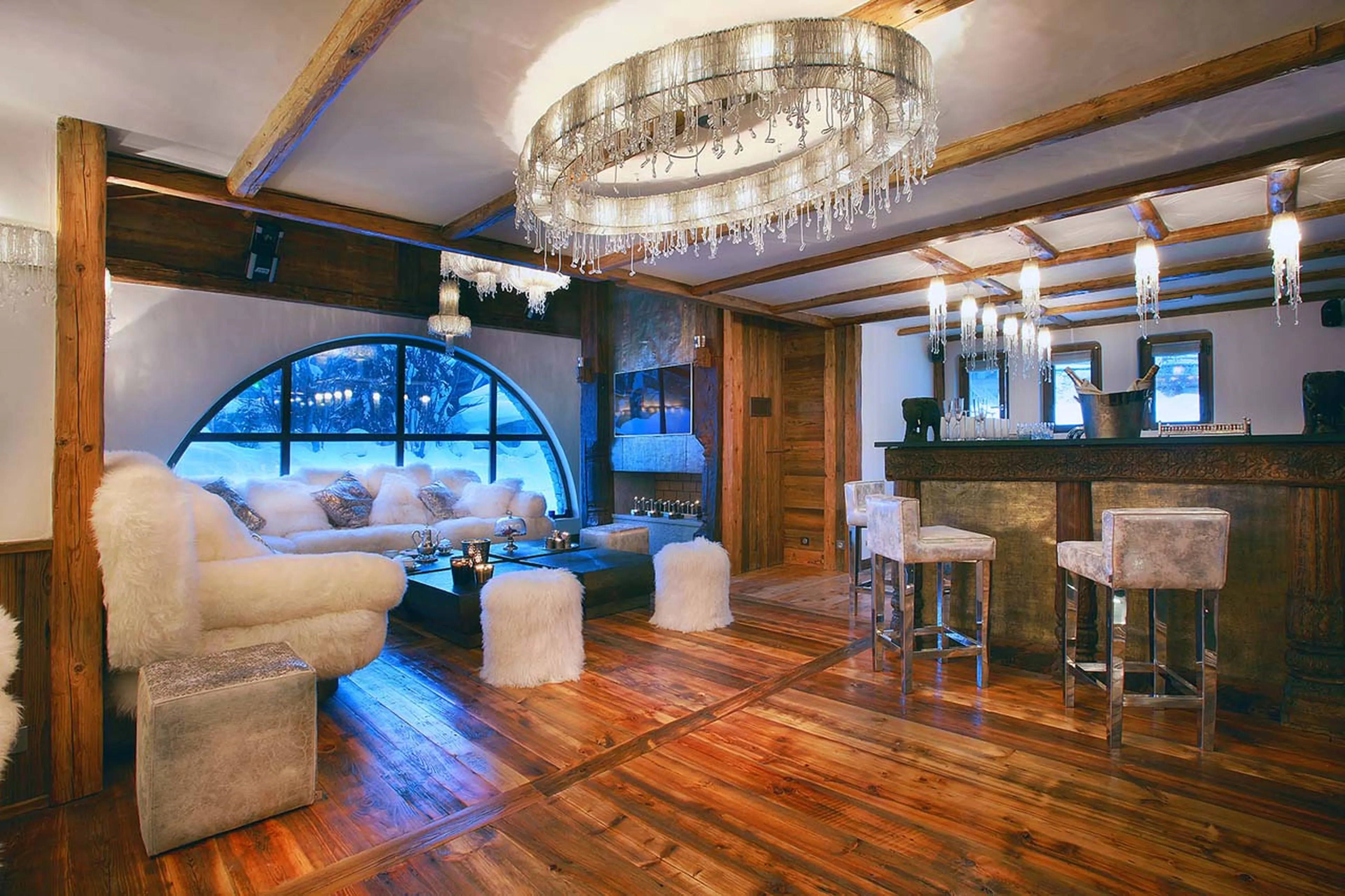Entertainment lounge, ethanol fireplace, bar and dance floor in Chalet Marco Polo in Val d’ Isere