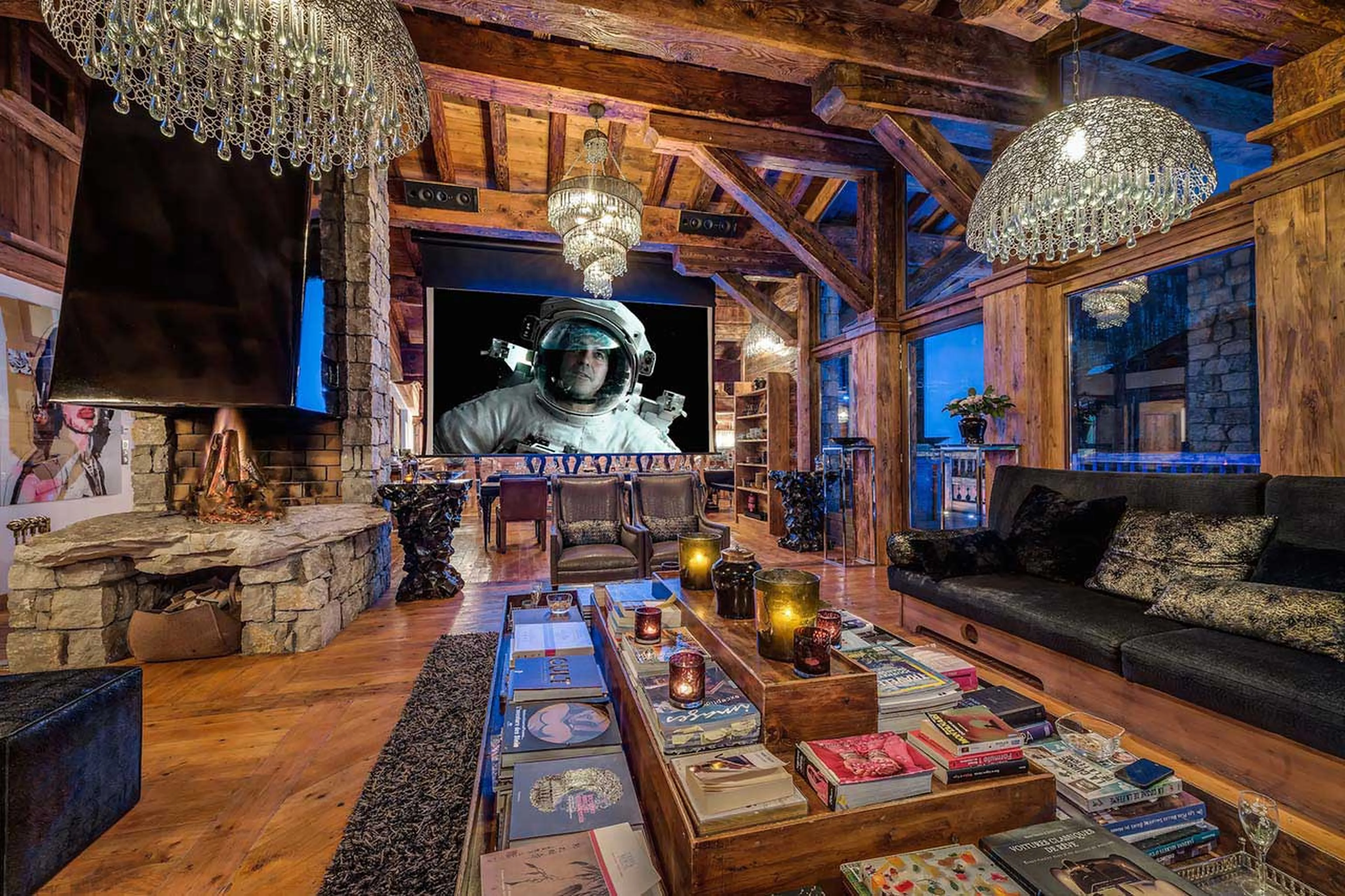 Large cinema screen from the high ceiling beams in Chalet Marco Polo in Val d’ Isere