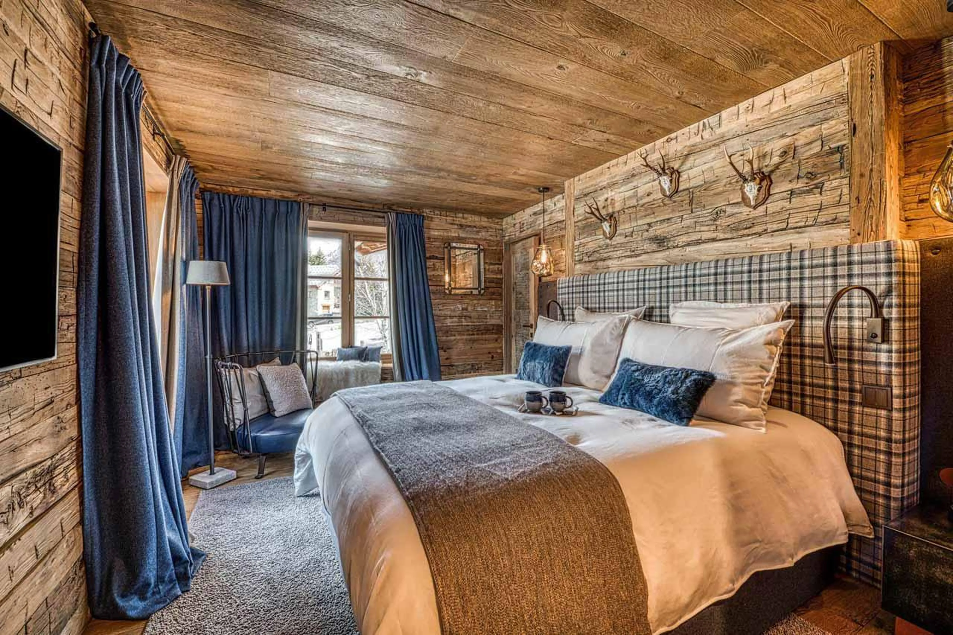 Double bedroom with French windows in Chalet Markhor, Val d'Isere