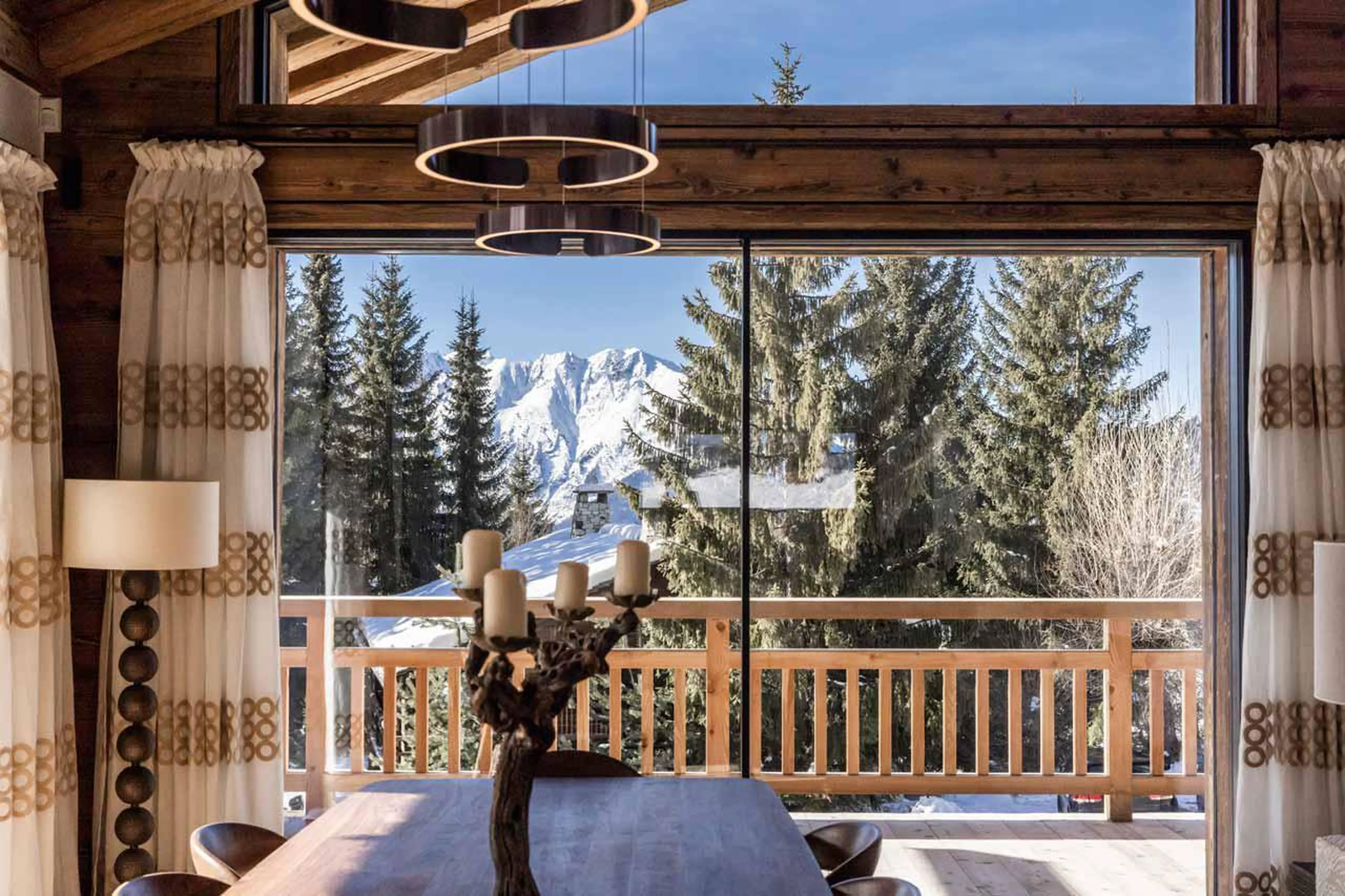 Dining table with modern lighting at Chalet Munro in Verbier
