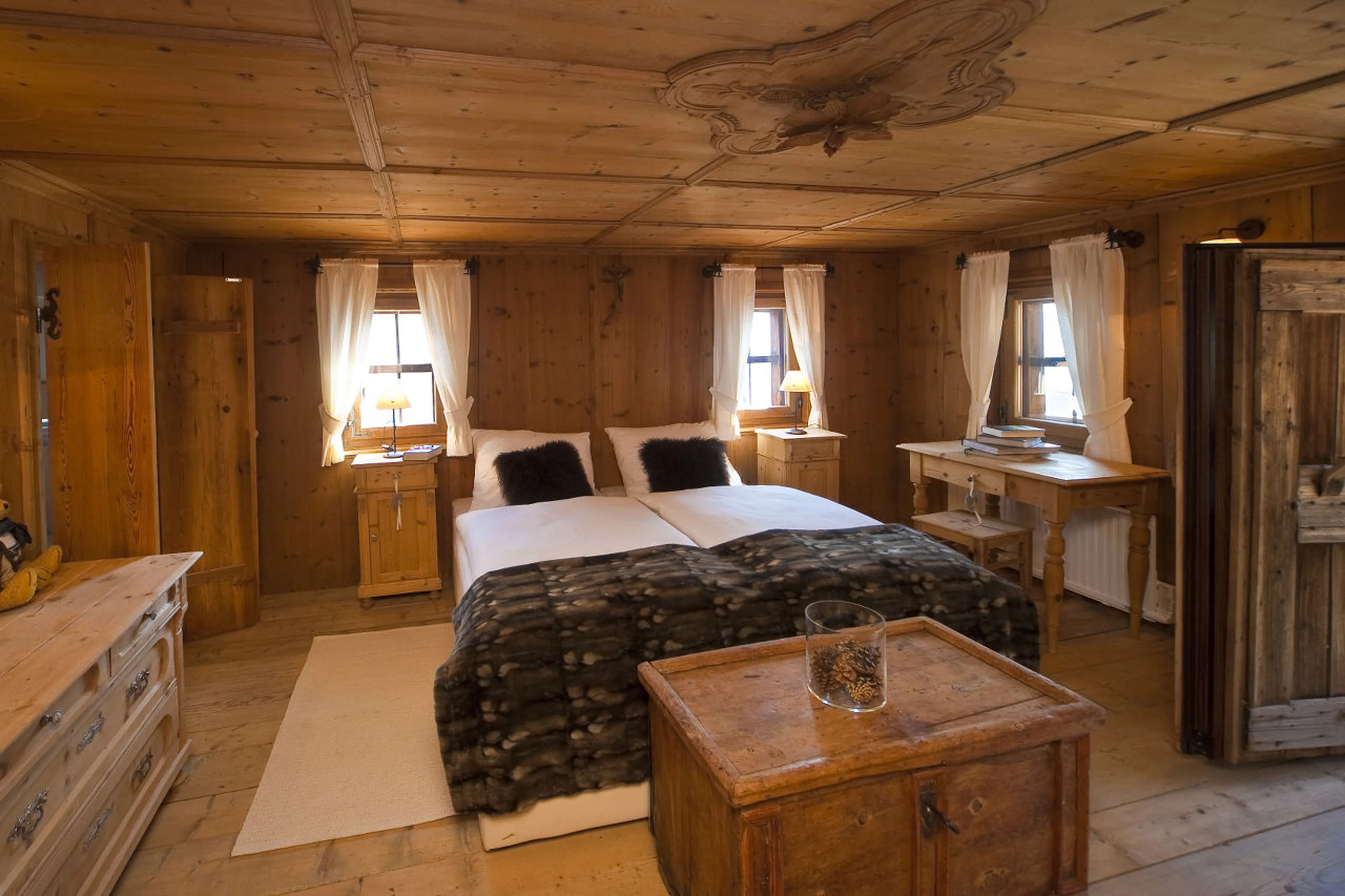Master double en-suite bedroom with balcony access in Chalet Obertreyen near Kronplatz