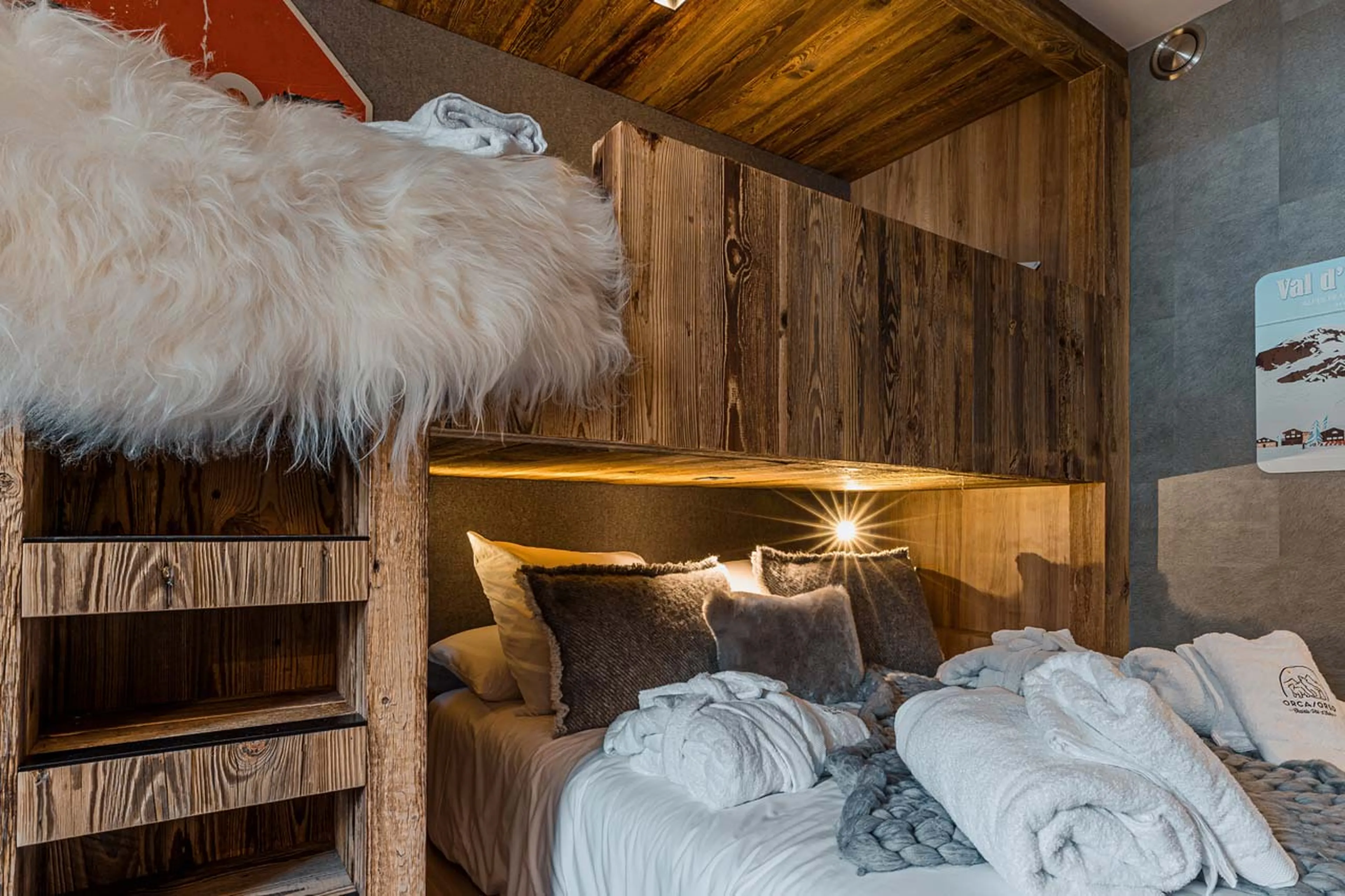 Double bed with single bed on top at Chalet Orca in Val d'Isere