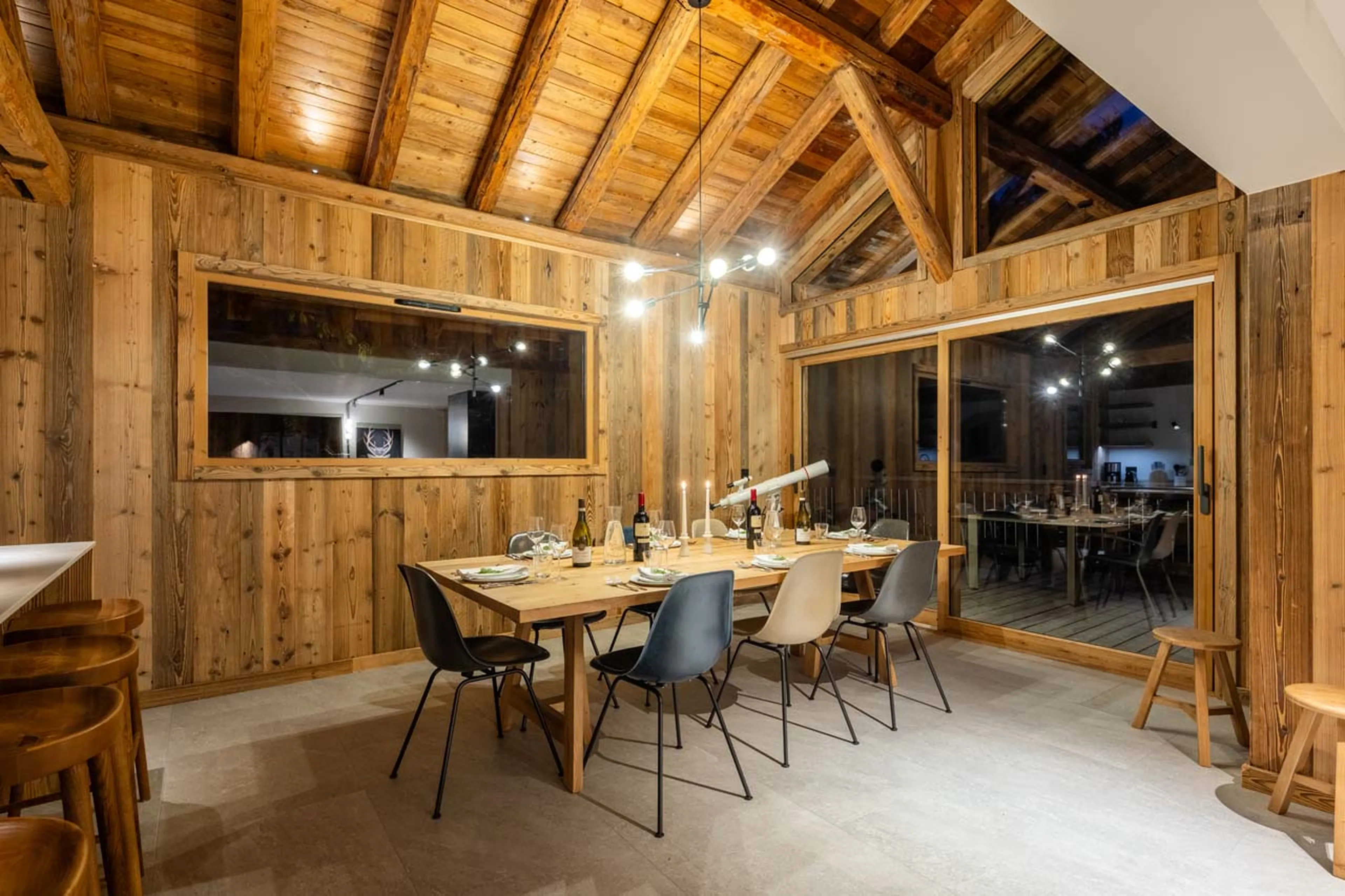 Dining area at night at Chalet L'Orchidée in Meribel