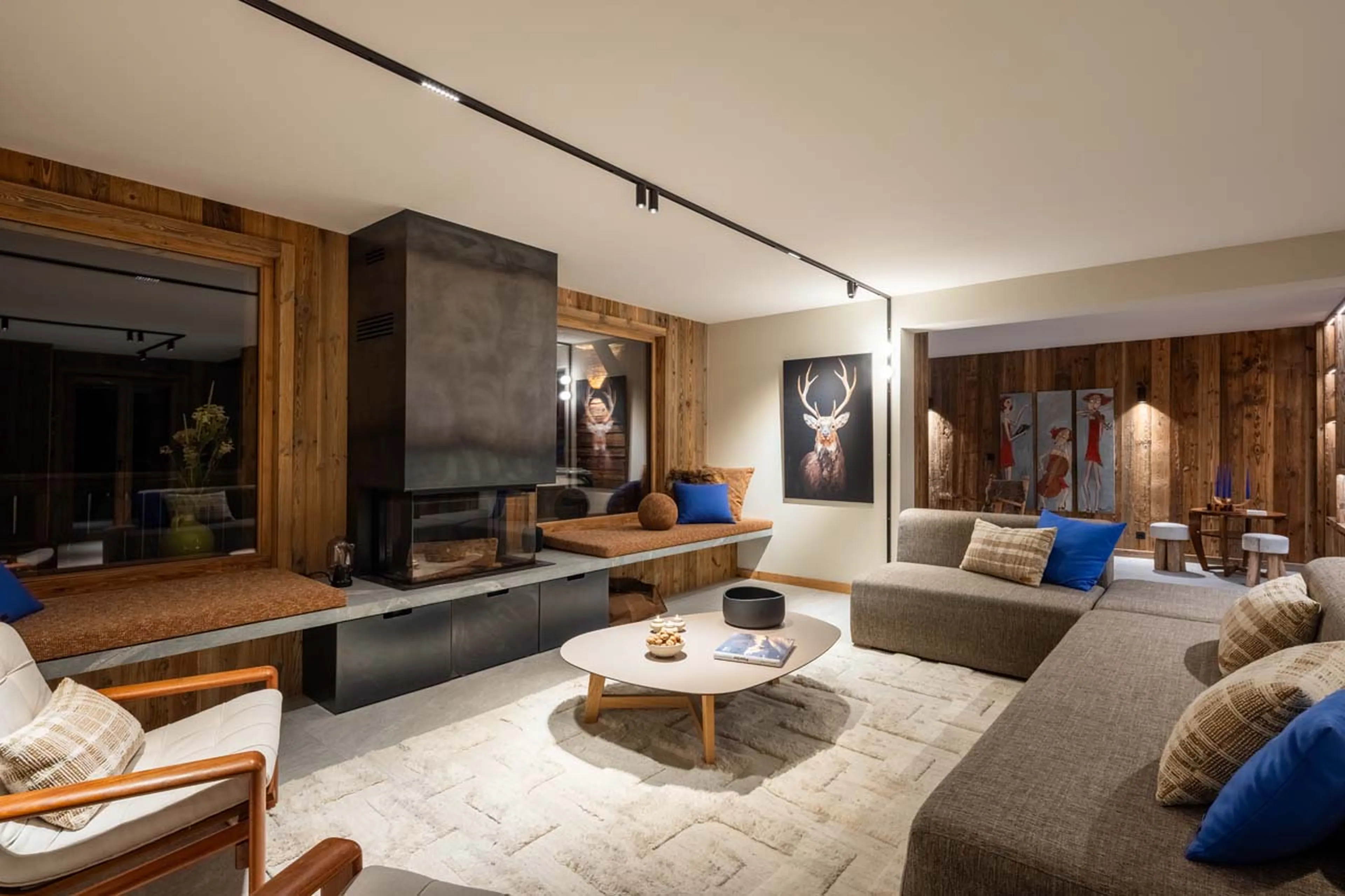 Living area at night at Chalet L'Orchidée in Meribel