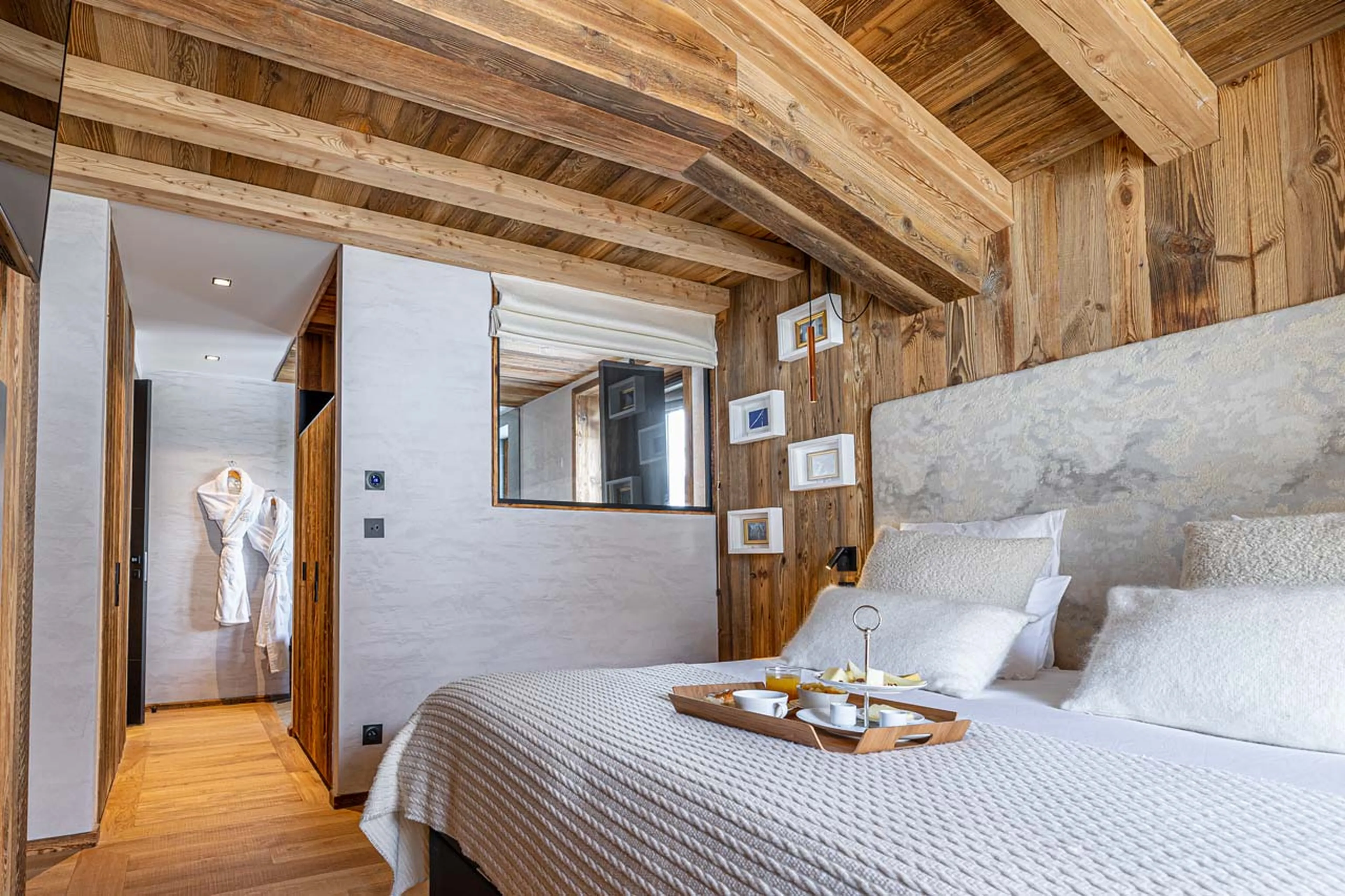 Double bed in bedroom one at Chalet Orso in Val d'Isere