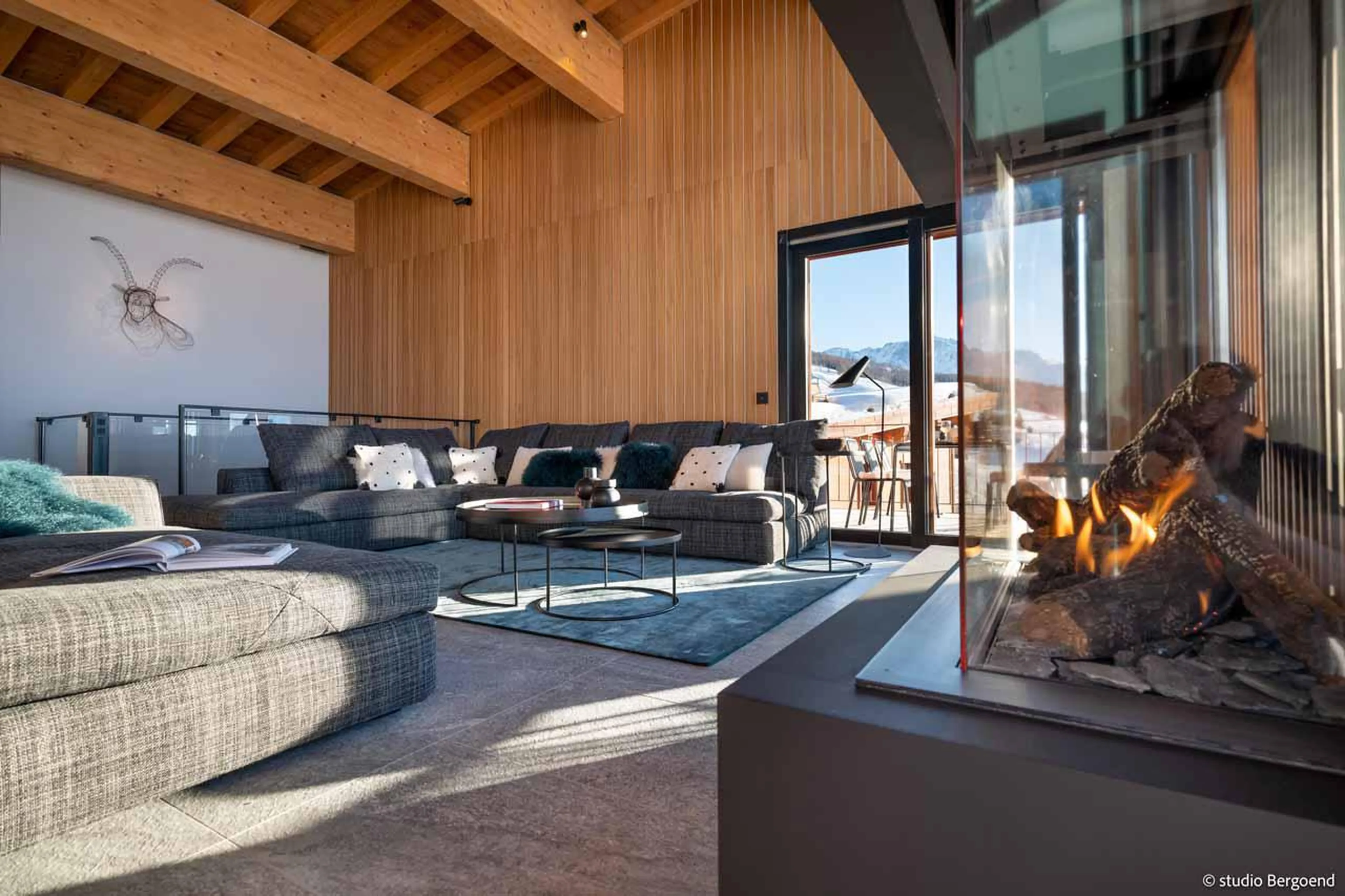 Gas fireplace in living area of Chalet Osarcs Mille 8 in Les Arcs