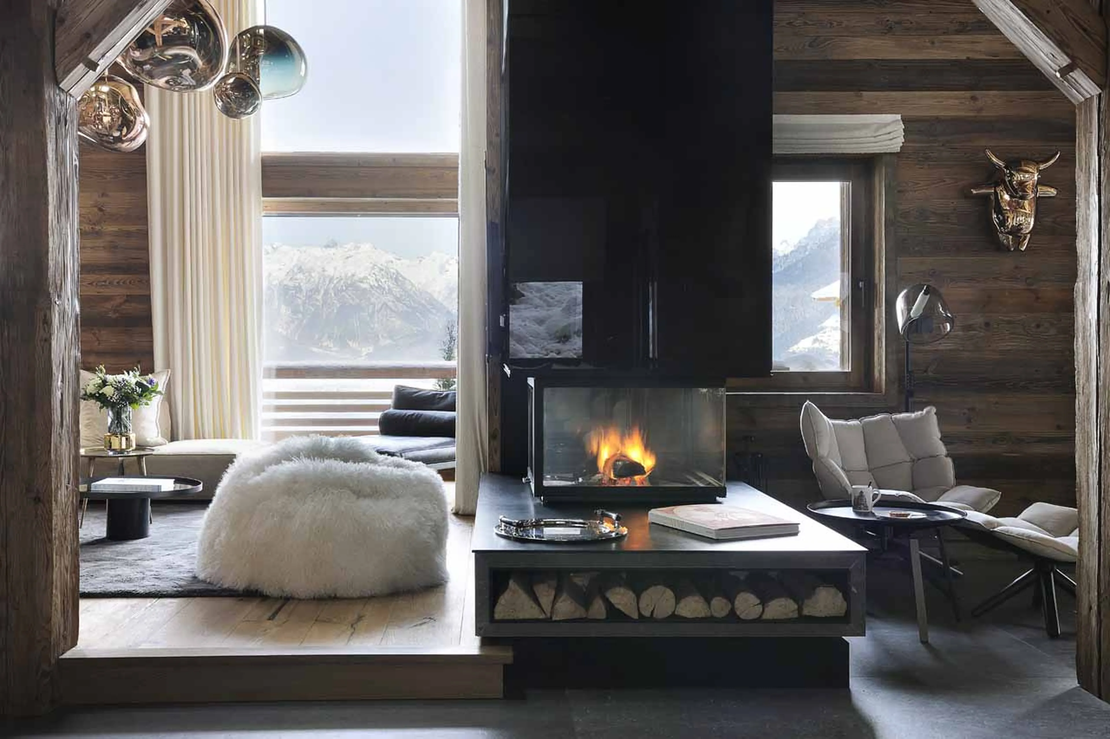 Fireplace in living area at Chalet Otoctone in Megeve