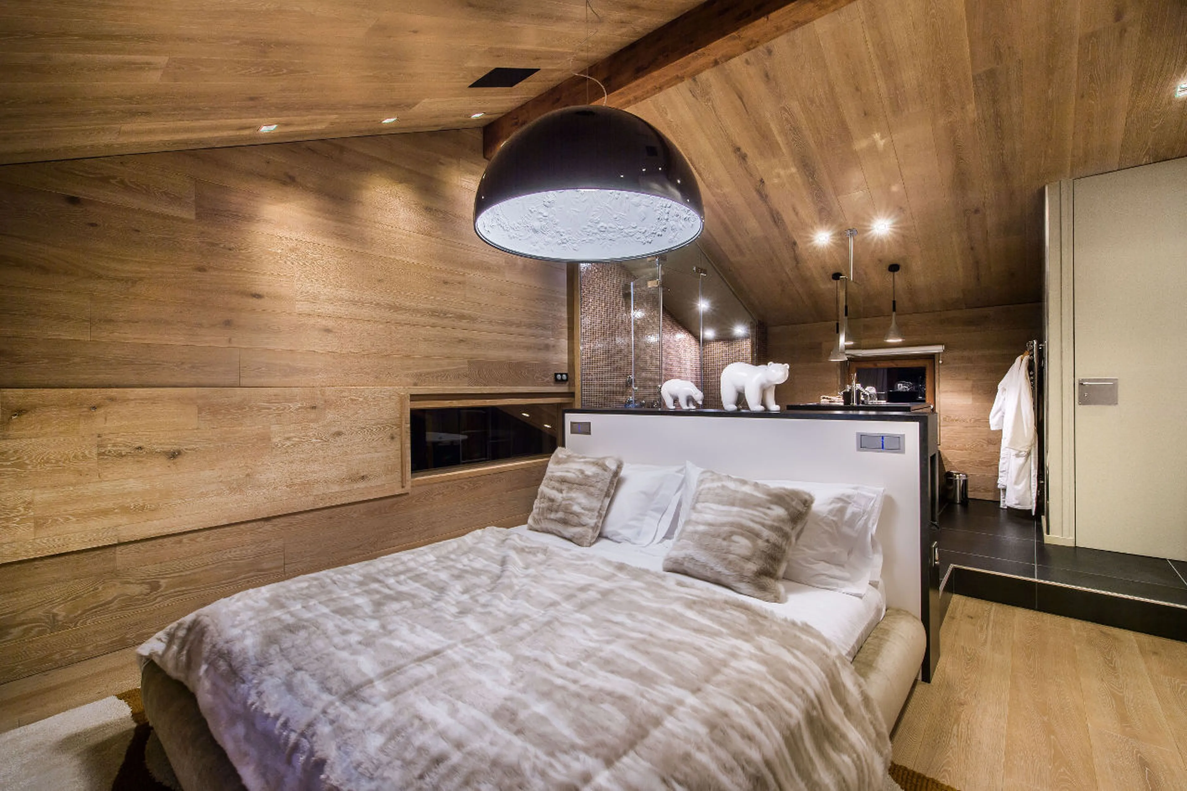 Master bedroom with TV, dressing room, safe and office area in Chalet Overview in Courchevel 1650