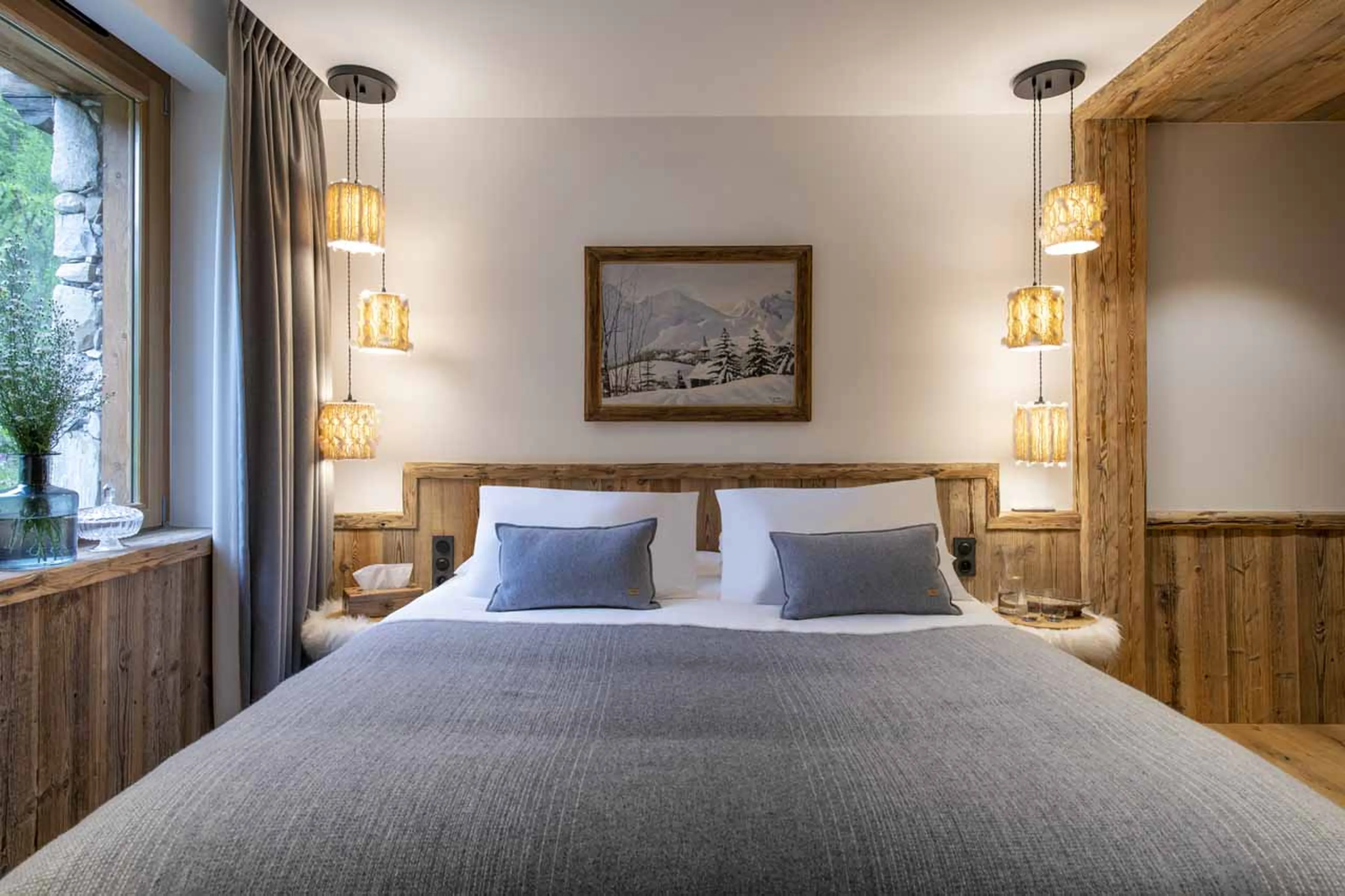 Double bed in master suite of Chalet Oxalis in Val d'Isere