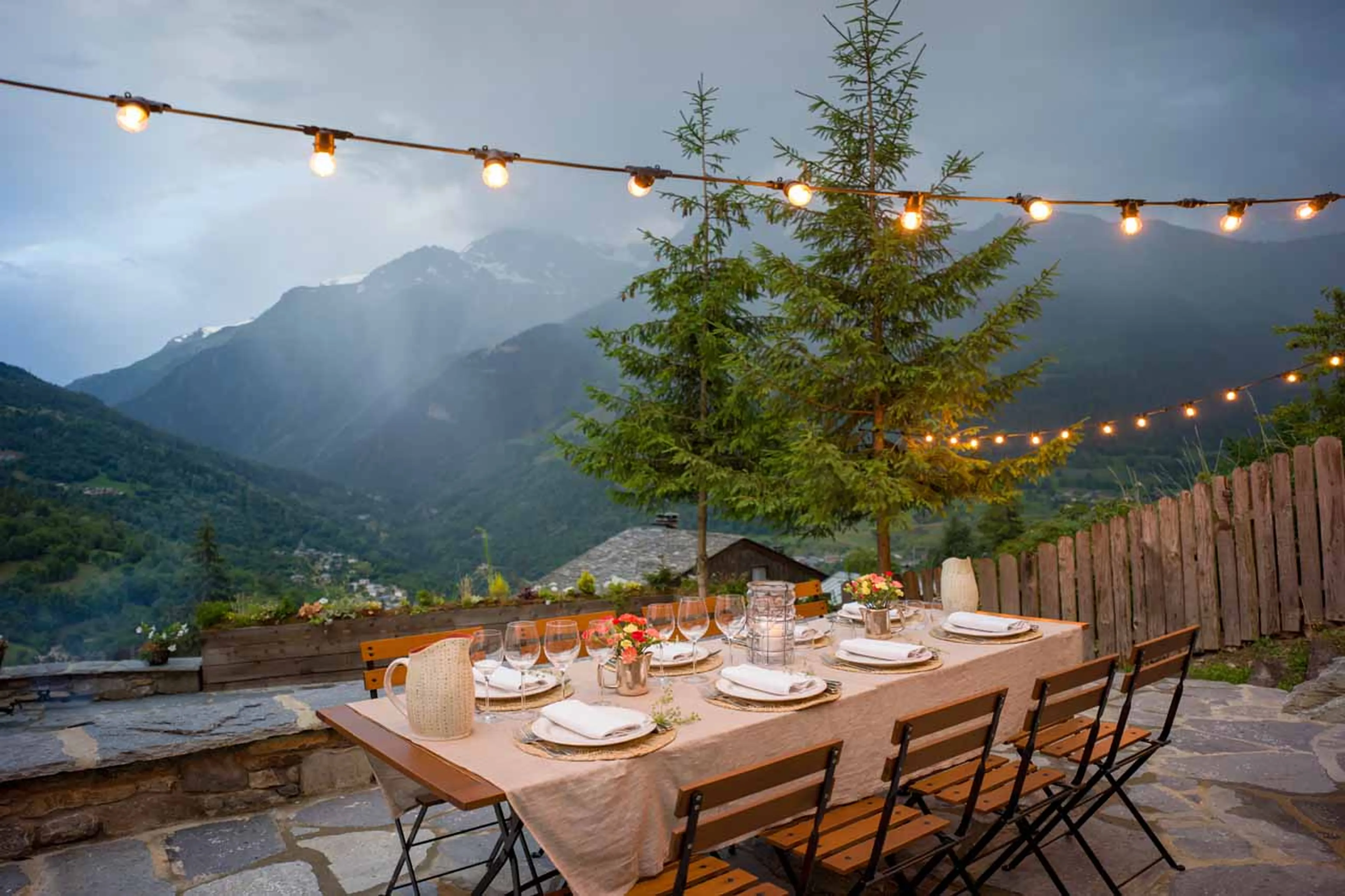 Dining on terrace at Chalet Pelerin in Le Miroir in summer