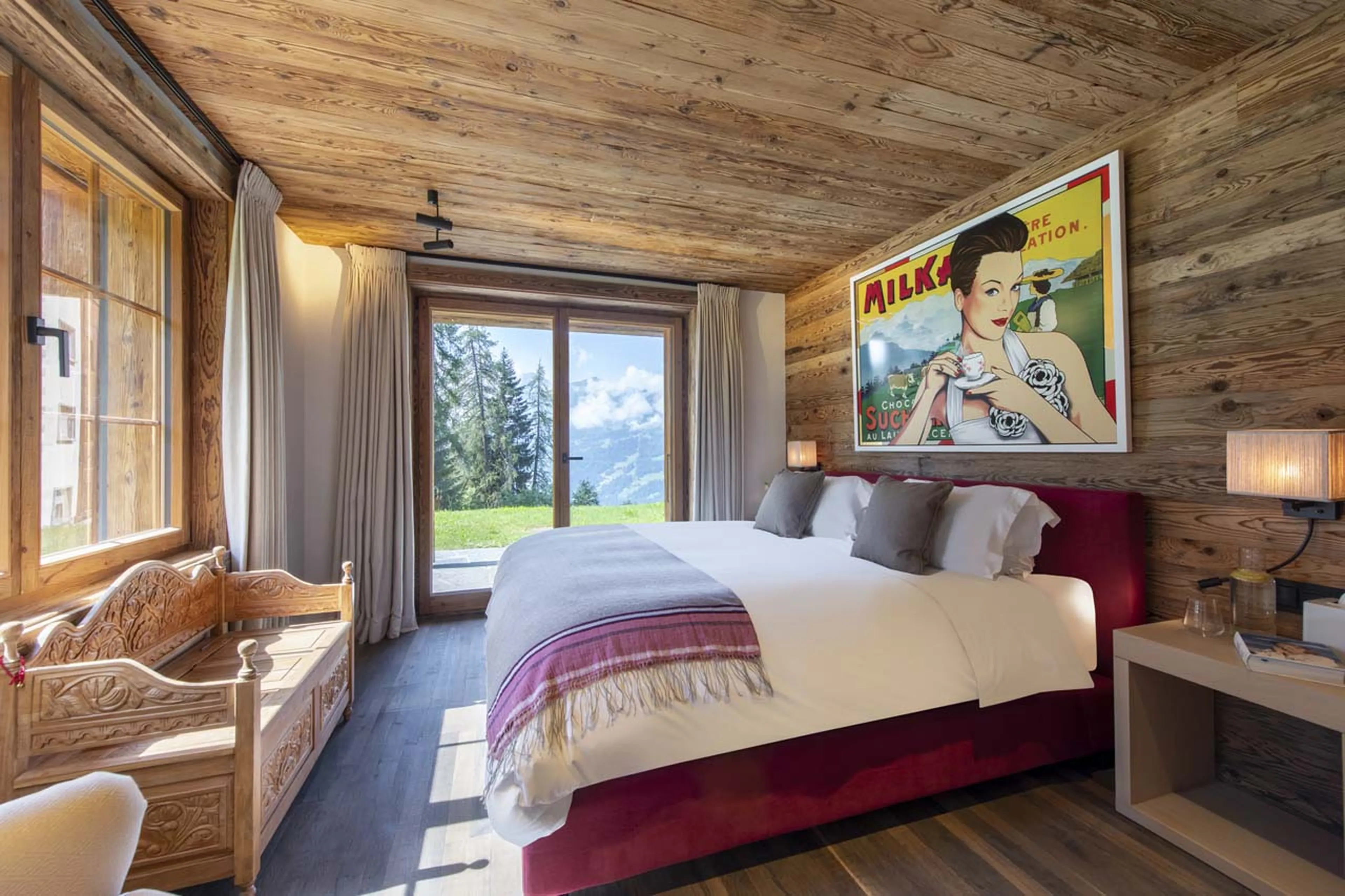 Bedroom four with terrace access at Chalet Peter Pan in Verbier