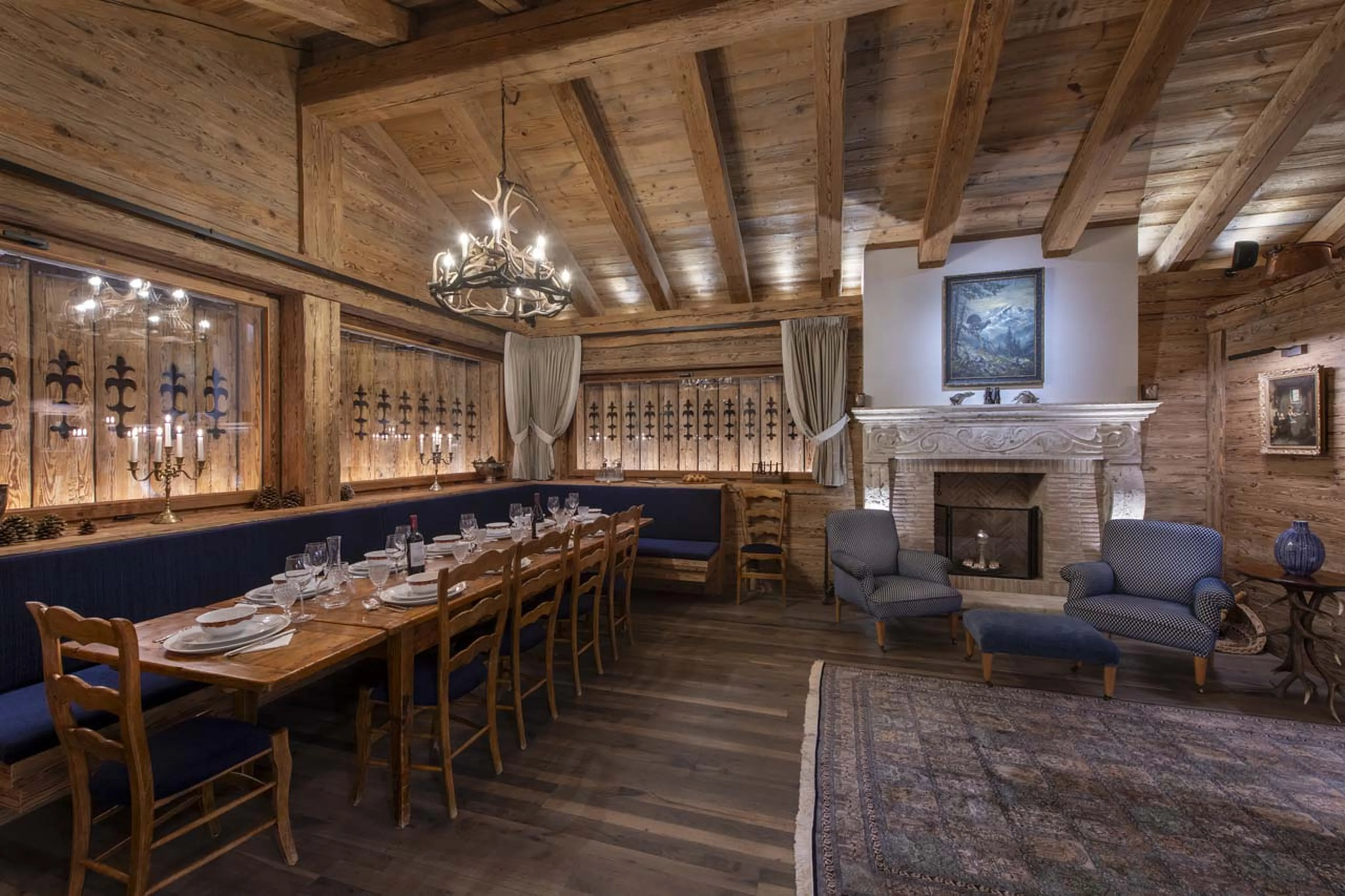Second fireplace and dining area at Chalet Peter Pan in Verbier