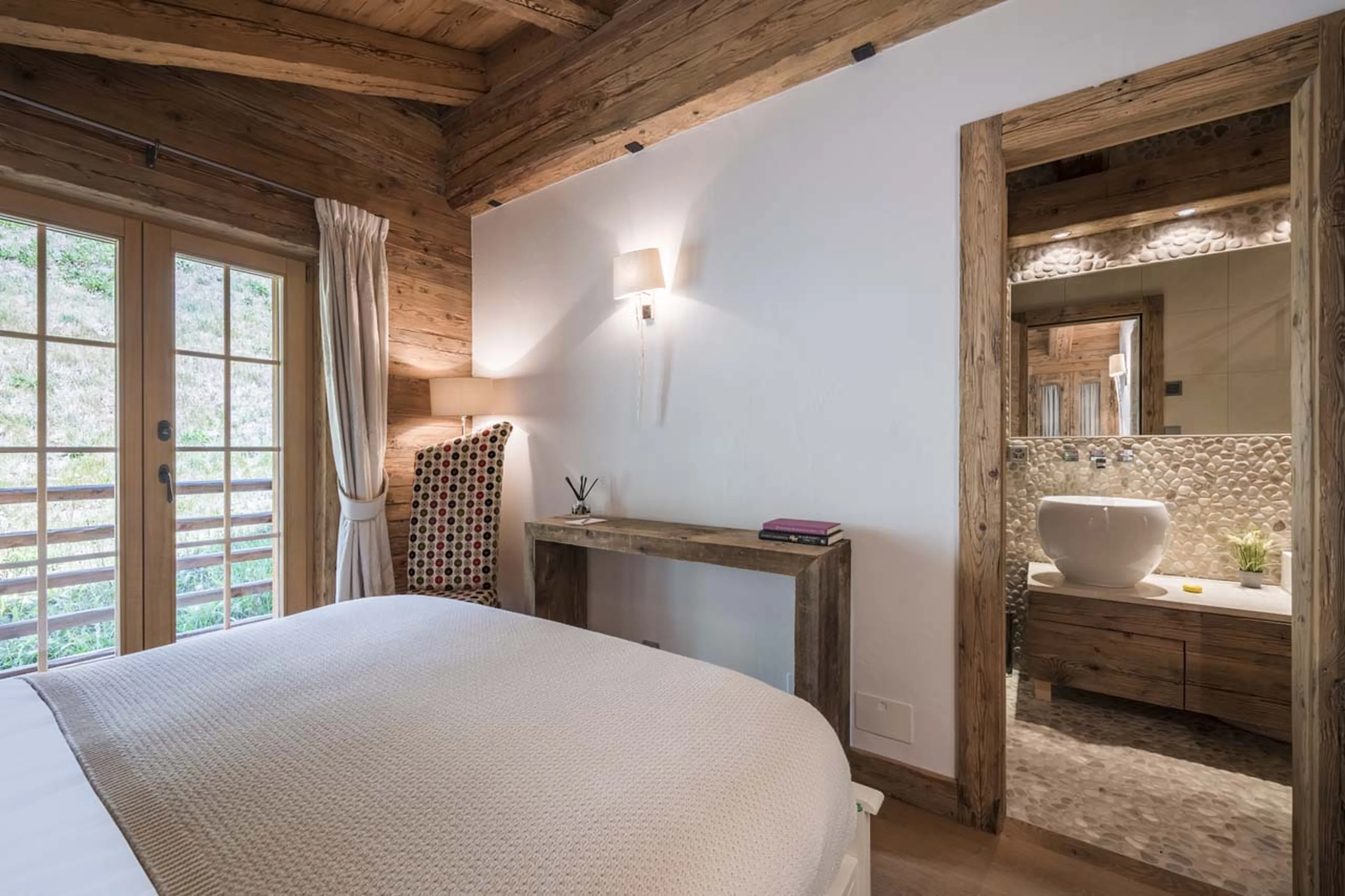 Bedroom two balcony access at Chalet Petit Ours in Verbier