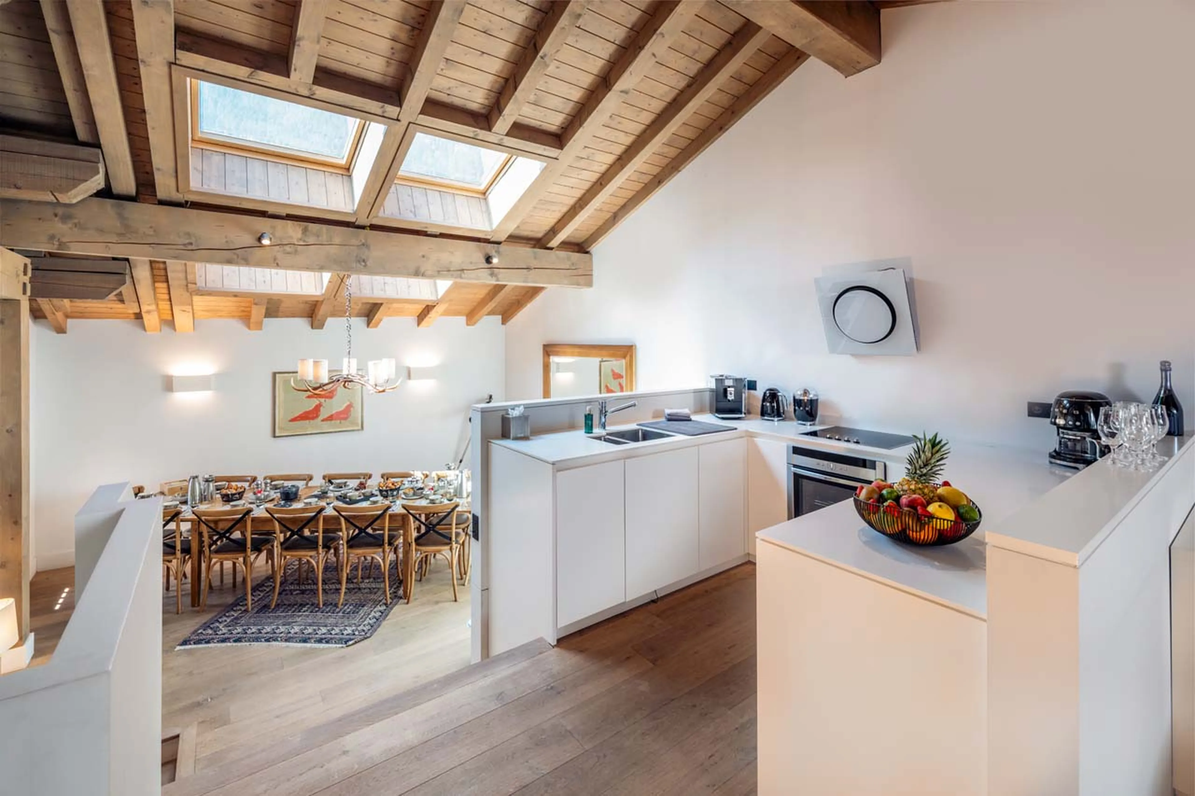 Dining table and kitchen in Chalet Pierremont, Courchevel Le Praz