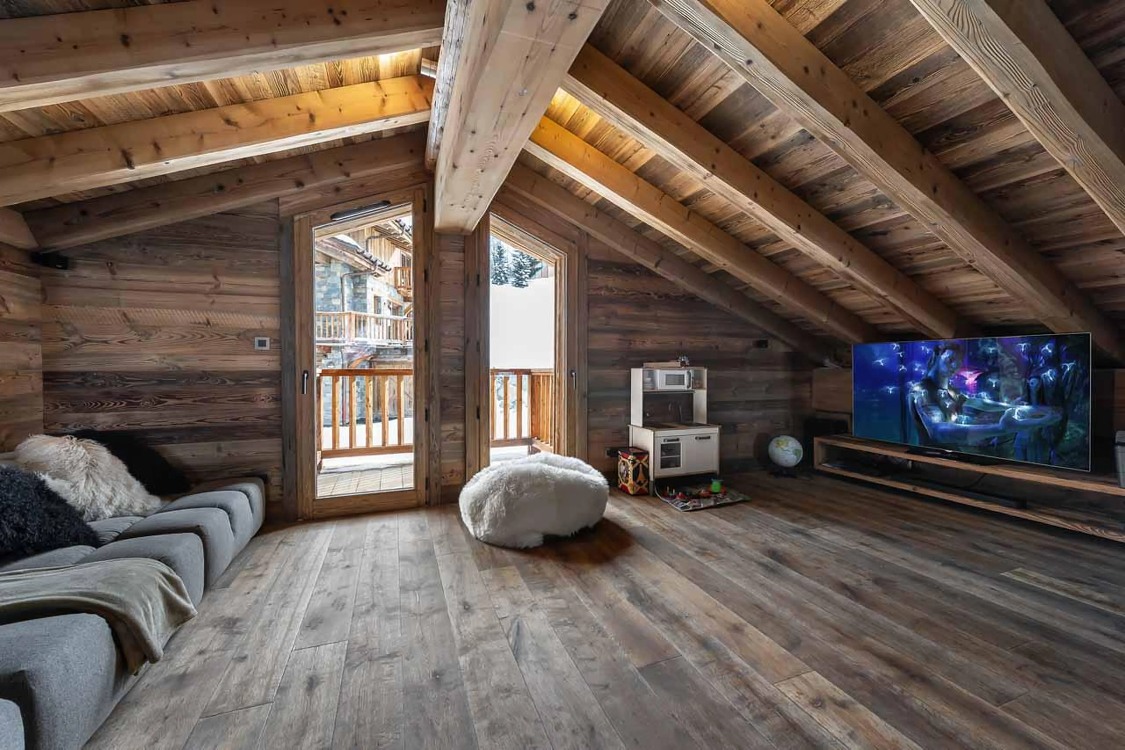 Mezzanine TV lounge at  Chalet Pure Black Crystal in St Martin de Belleville