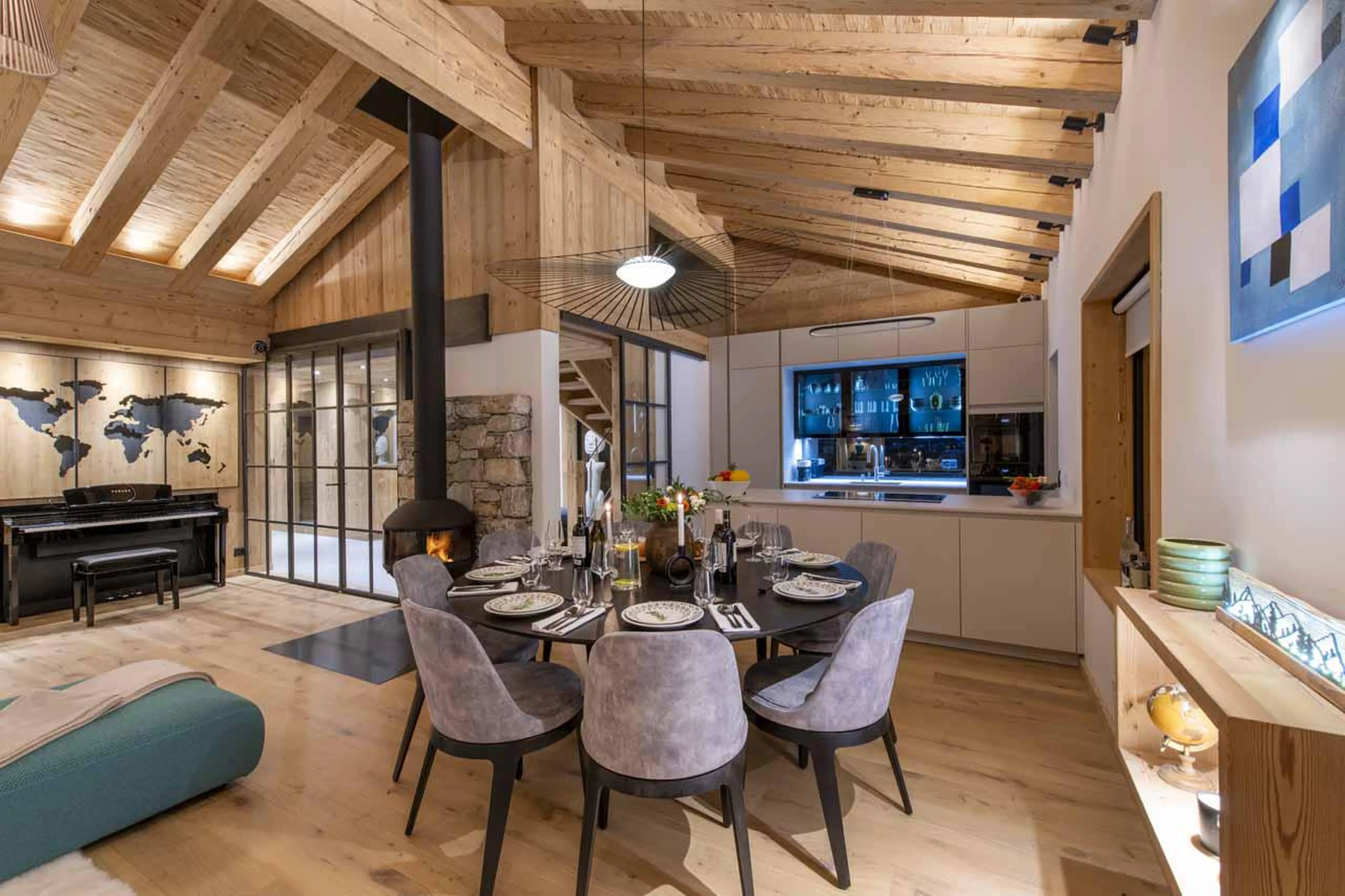 Dining table and kitchen in Chalet Ranch, Verbier
