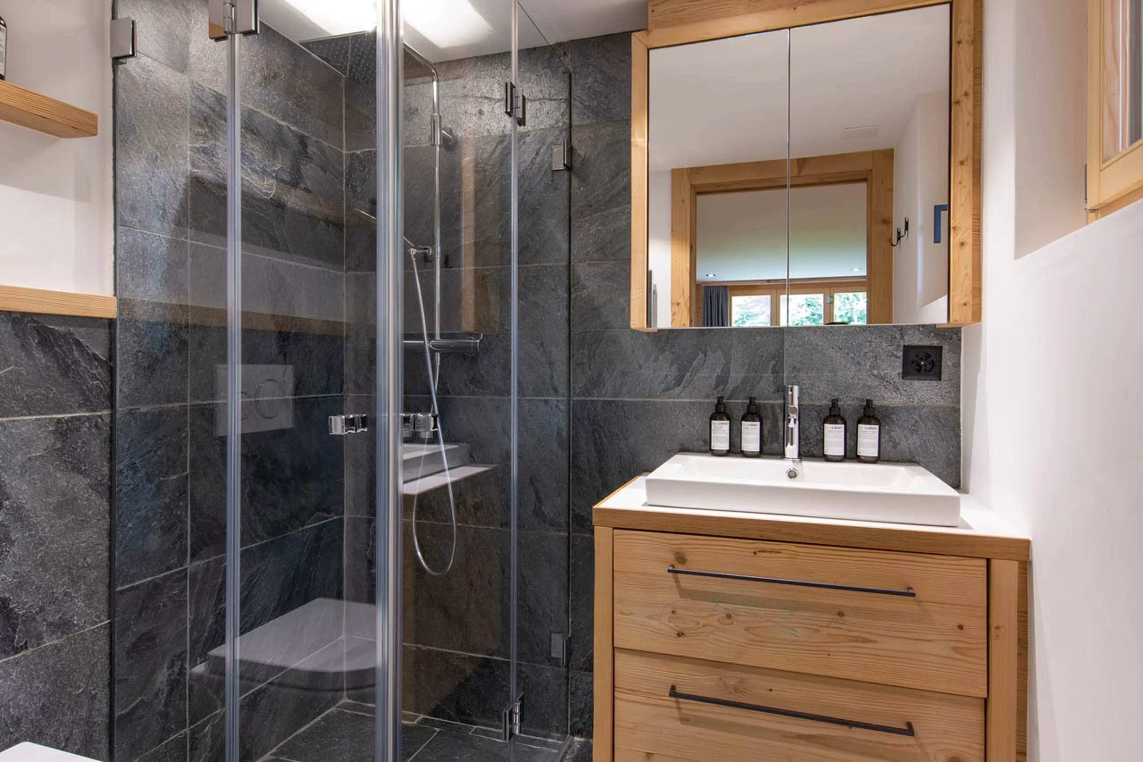 En-suite shower room to TV room at Chalet Roselle in Verbier