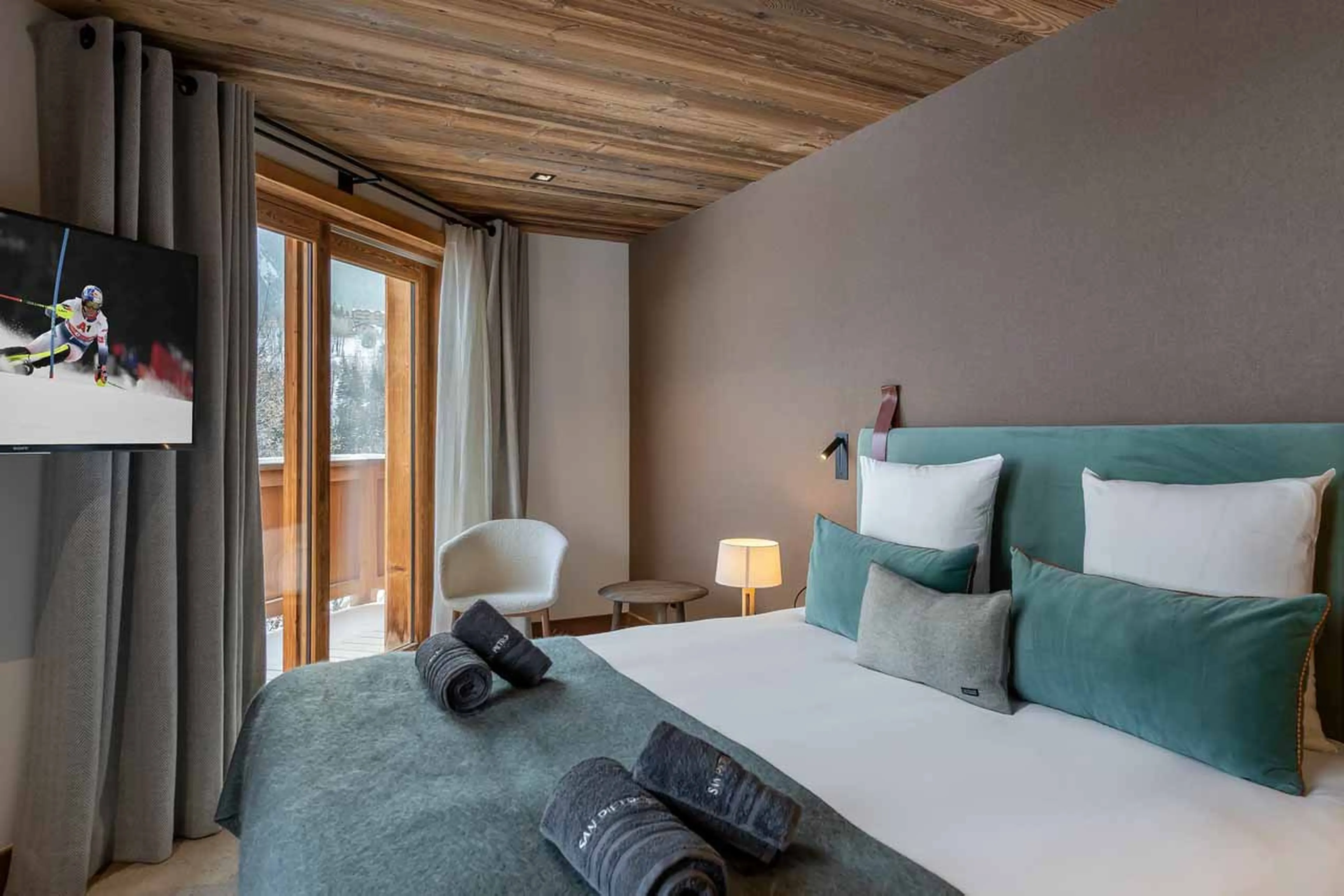 Access to balcony from bedroom one at Chalet San Pietro in Courchevel 1850