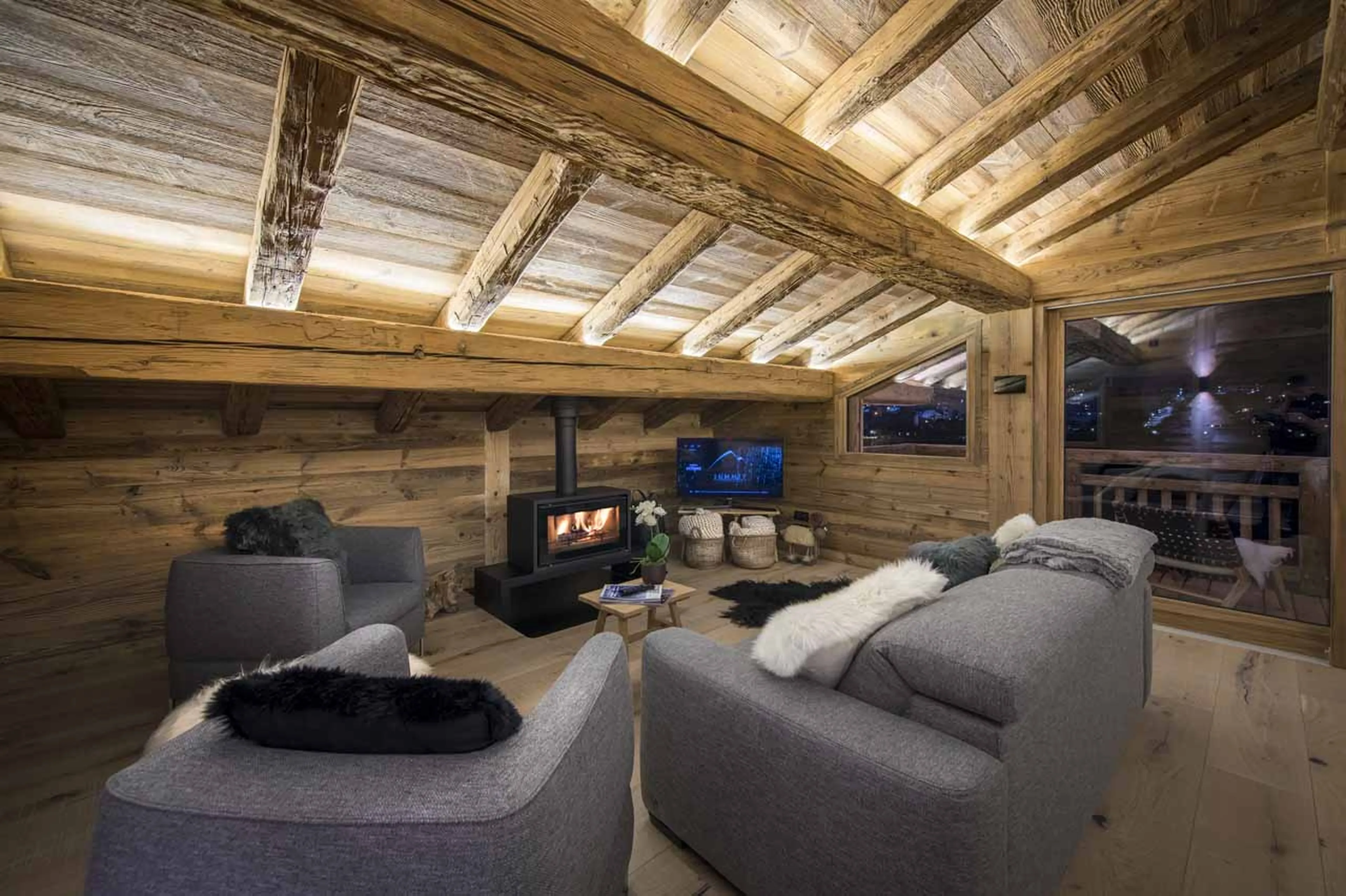 Living area at night at Little Gem Morzine