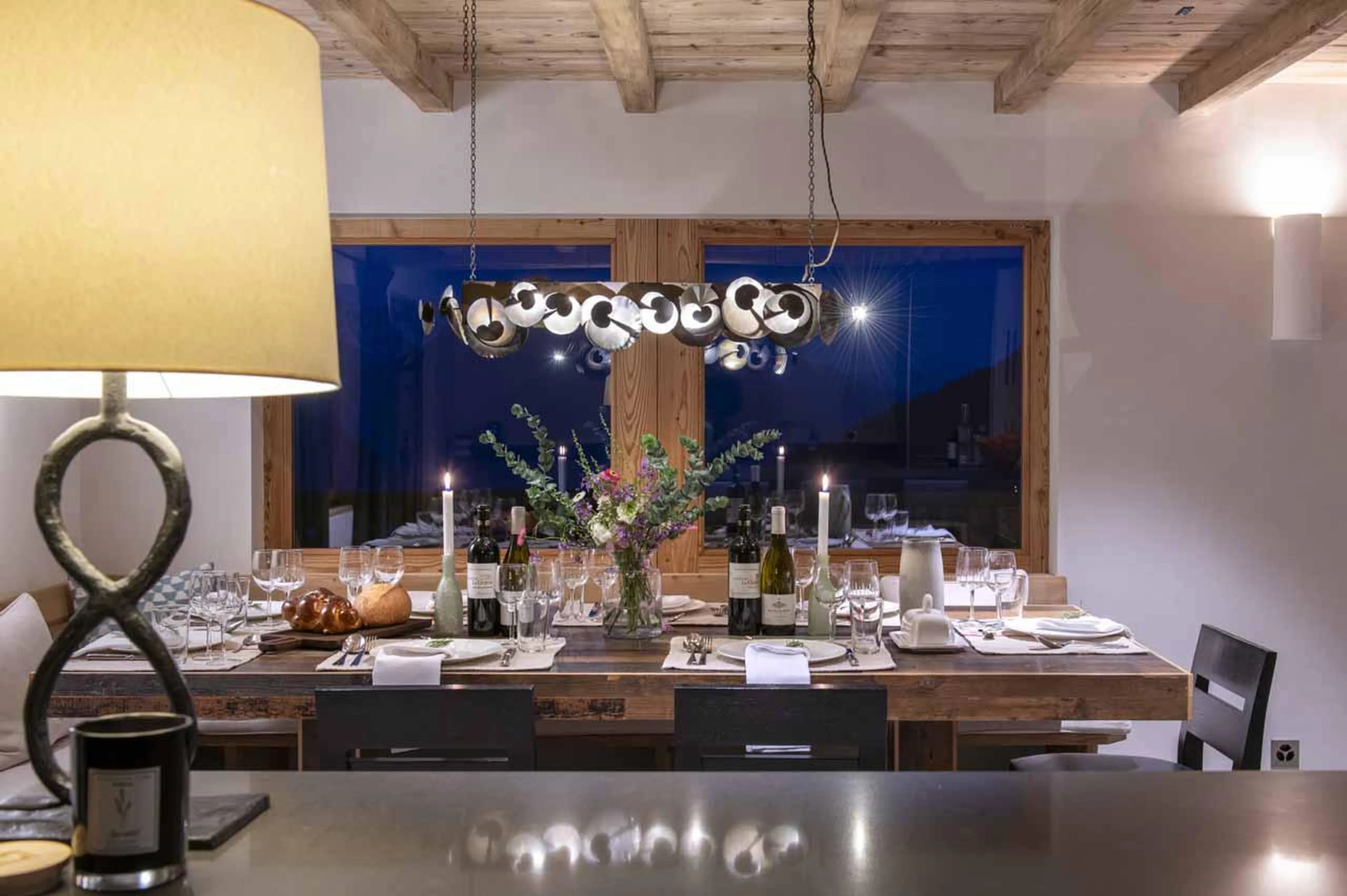 View of dining table from kitchen, Chalet Scandinavia, Verbier, Switzerland