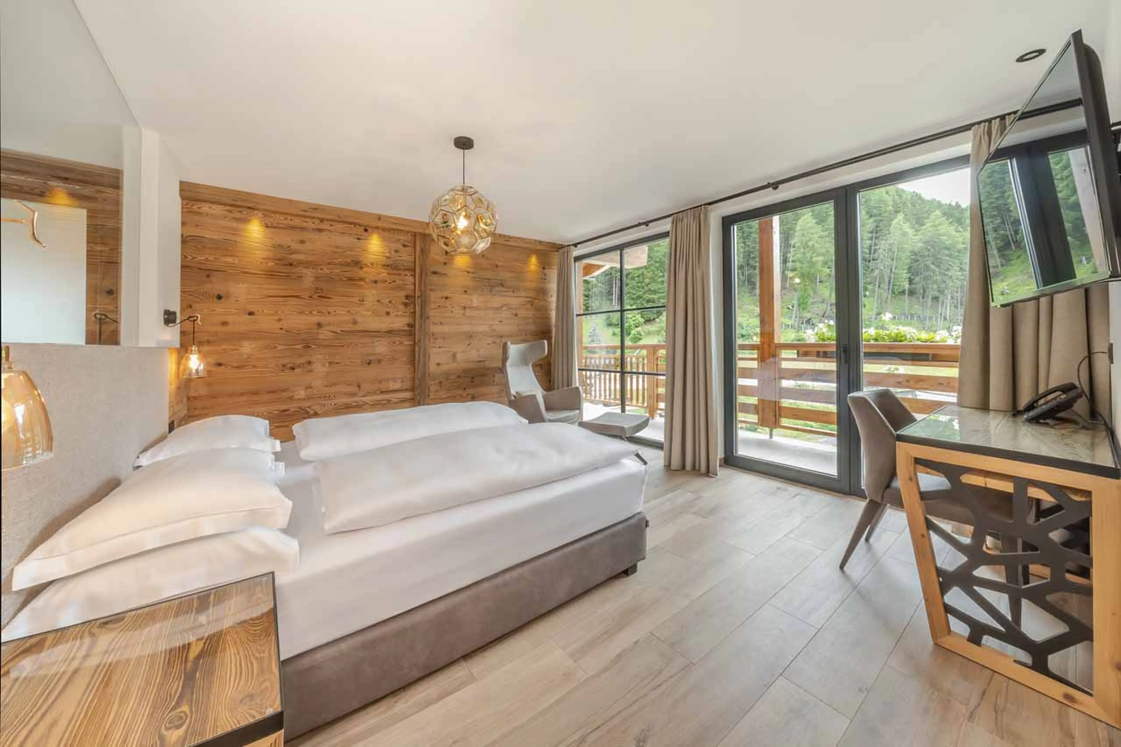 Bedroom one in summer at Chalet Sellaronda in Val Gardena