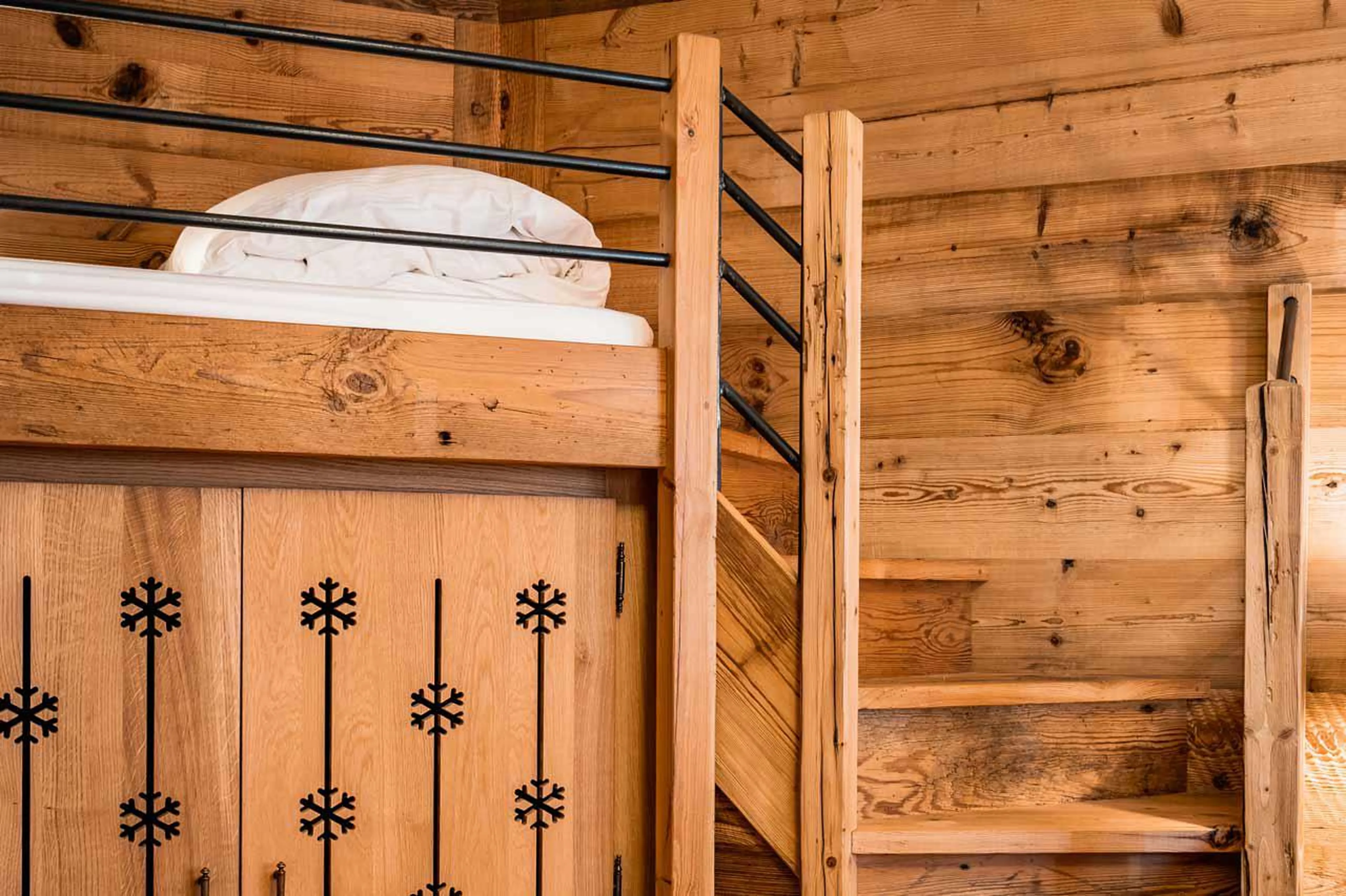 The elevated child’s bed has its own set of steps in Chalet Sequoia in Val d’ Isere