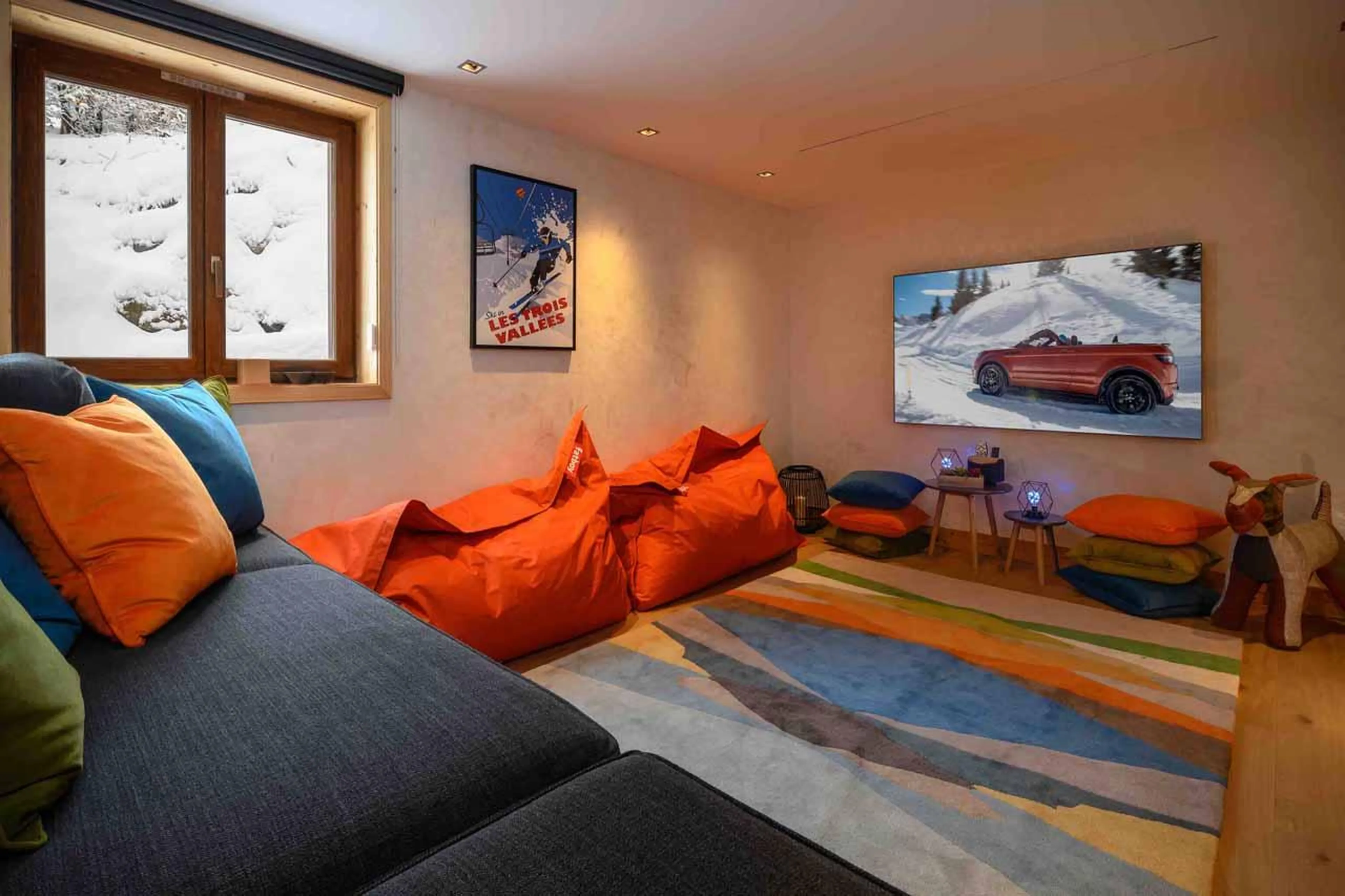 TV room with sofa and bean bags in Chalet Serendipity, Meribel