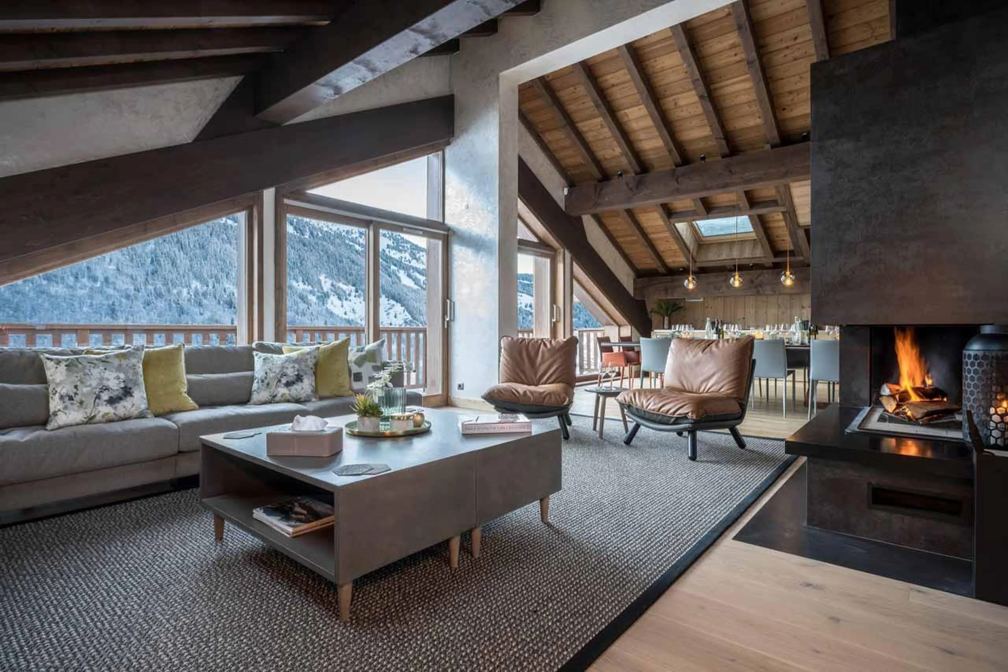 Living area with sofas and fireplace in Chalet Serendipity, Meribel