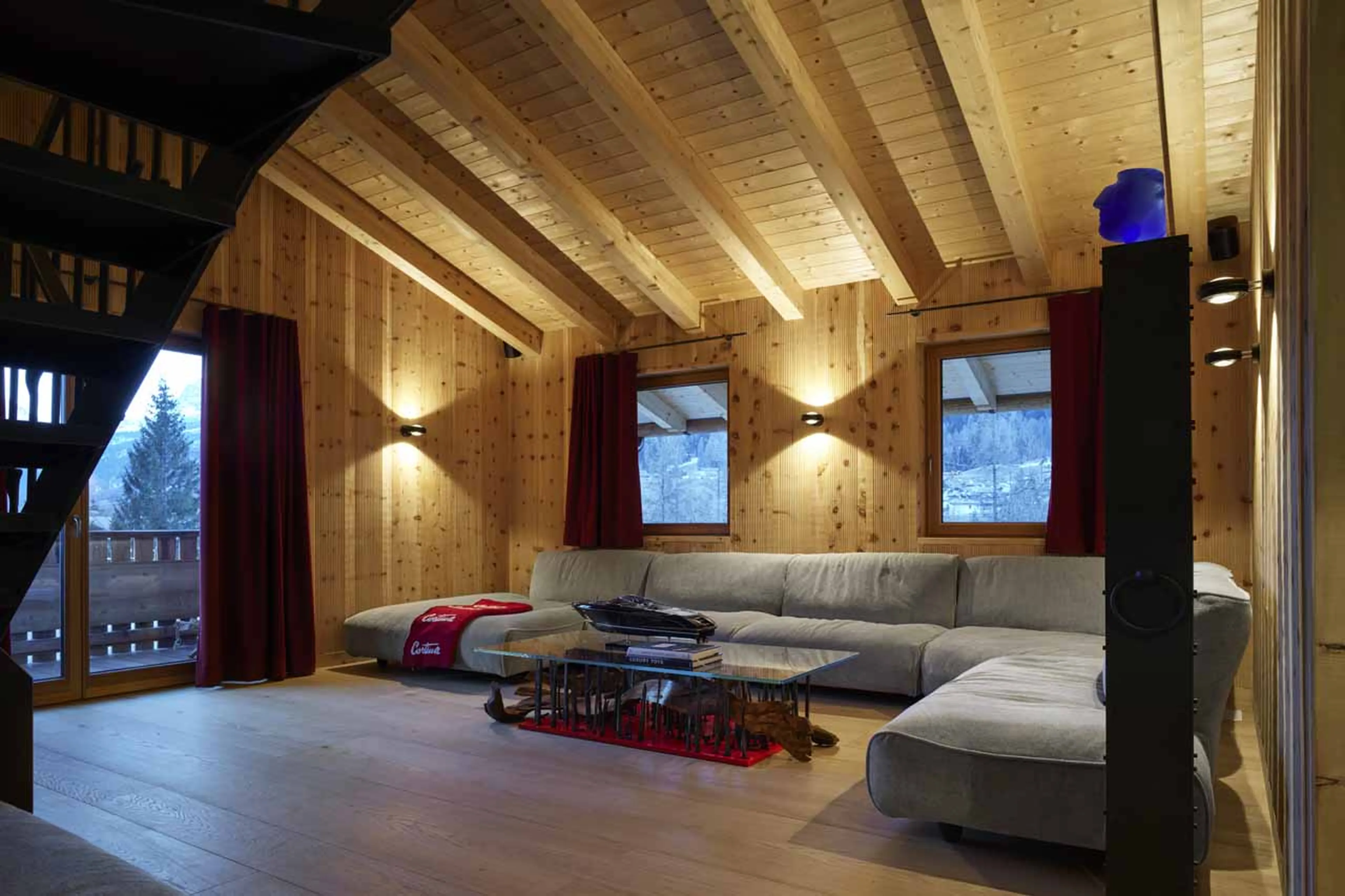 Living area with balcony access at Chalet Serge in Cortina