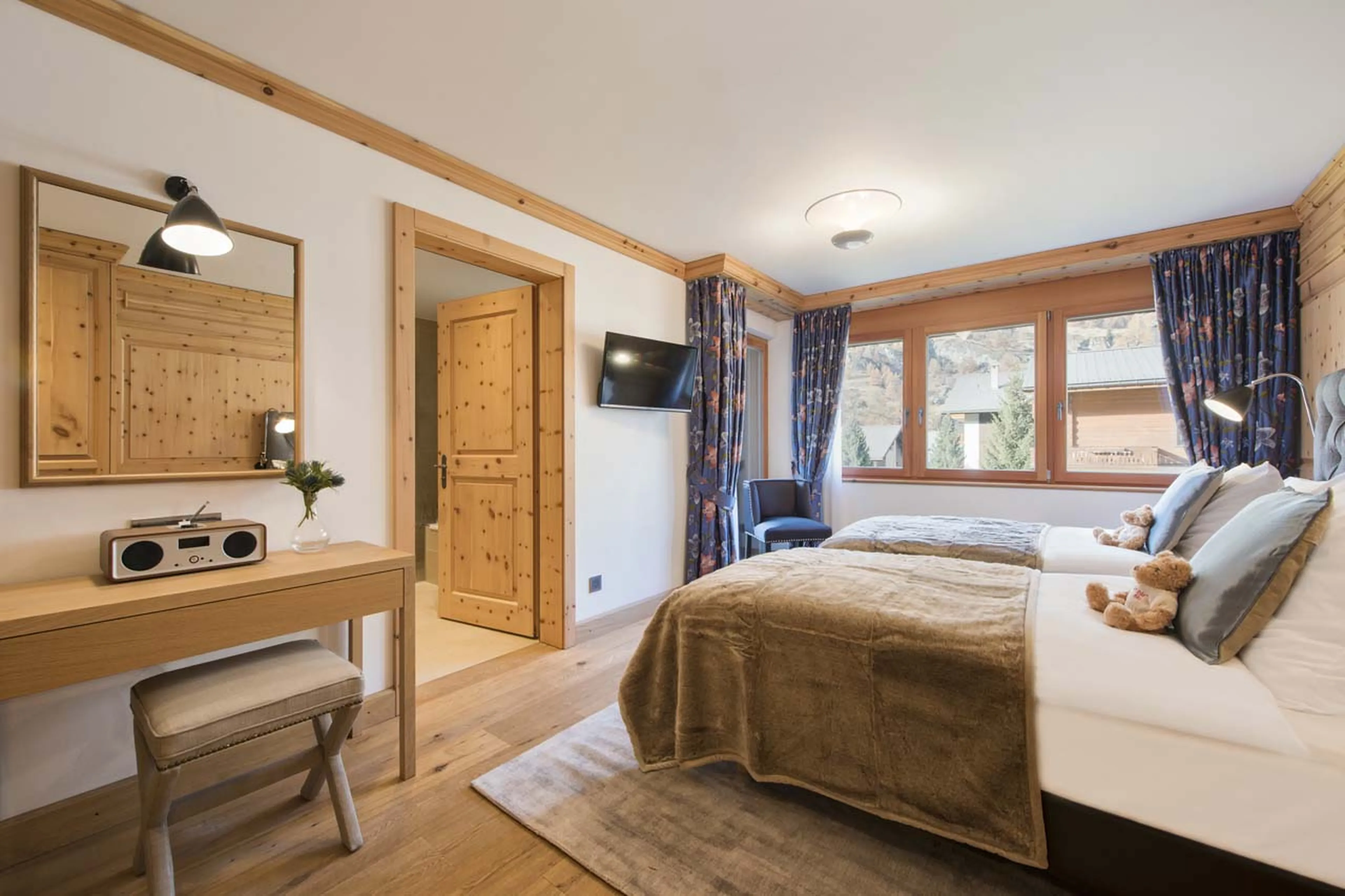 TV in bedroom three at Chalet Shalimar in Zermatt