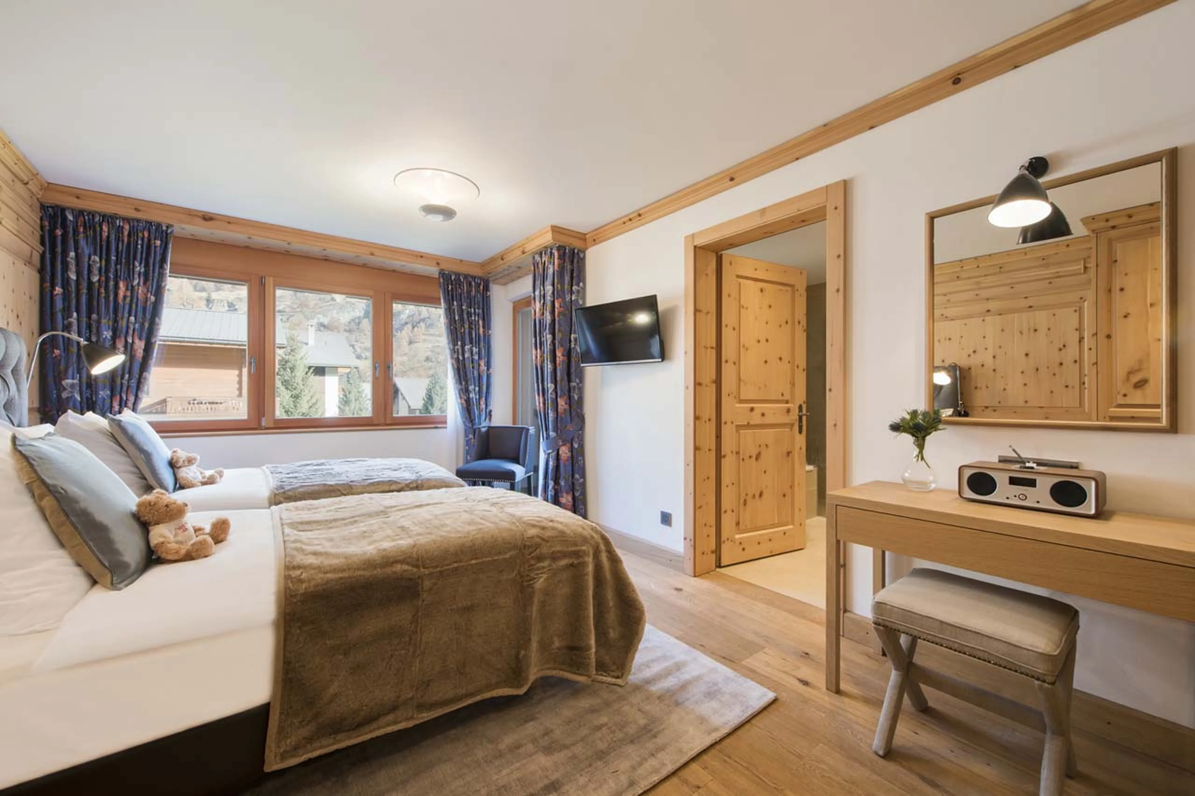 TV in bedroom four at Chalet Shalimar in Zermatt