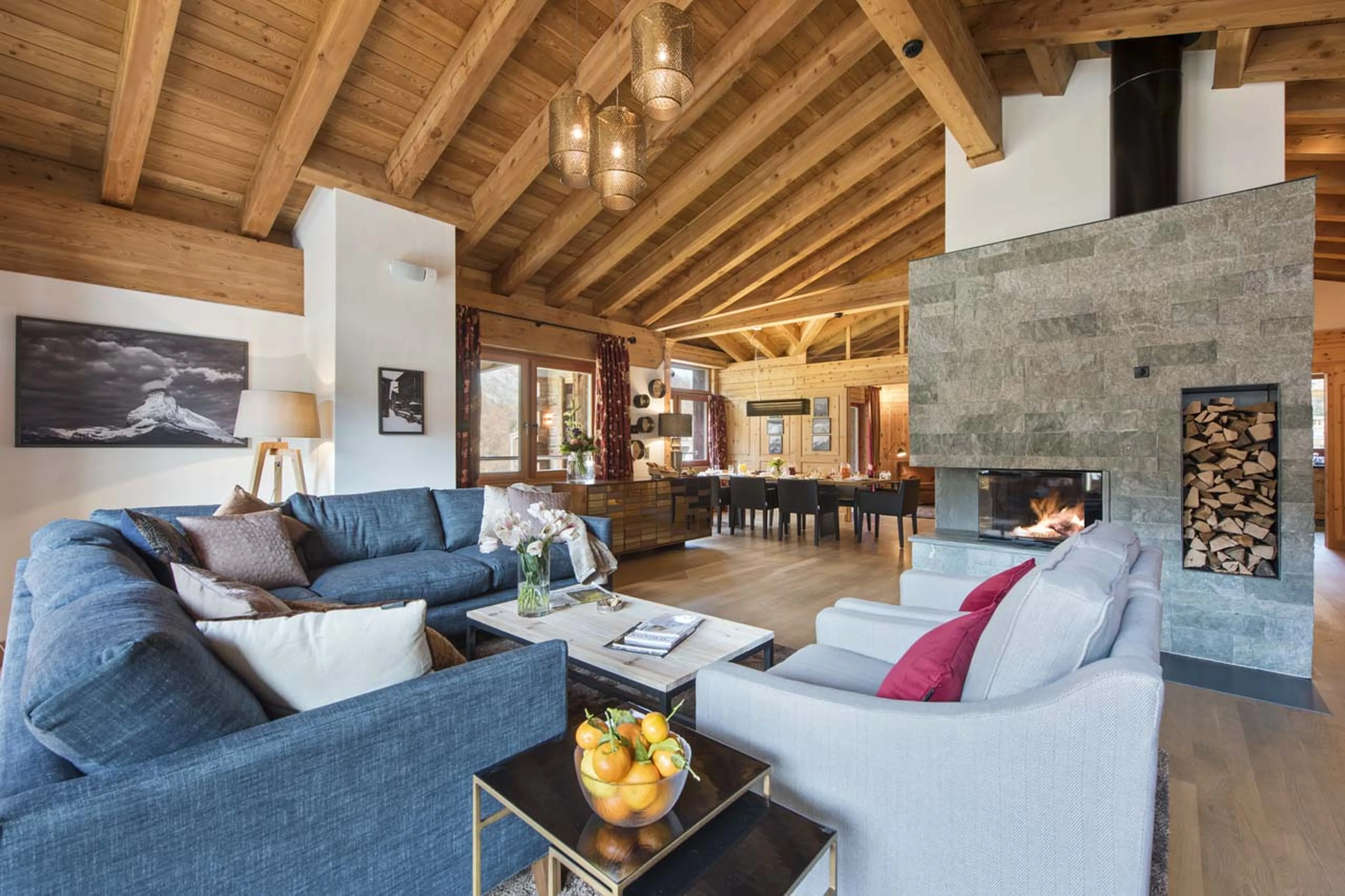 Central fireplace in living area of Chalet Shalimar in Zermatt