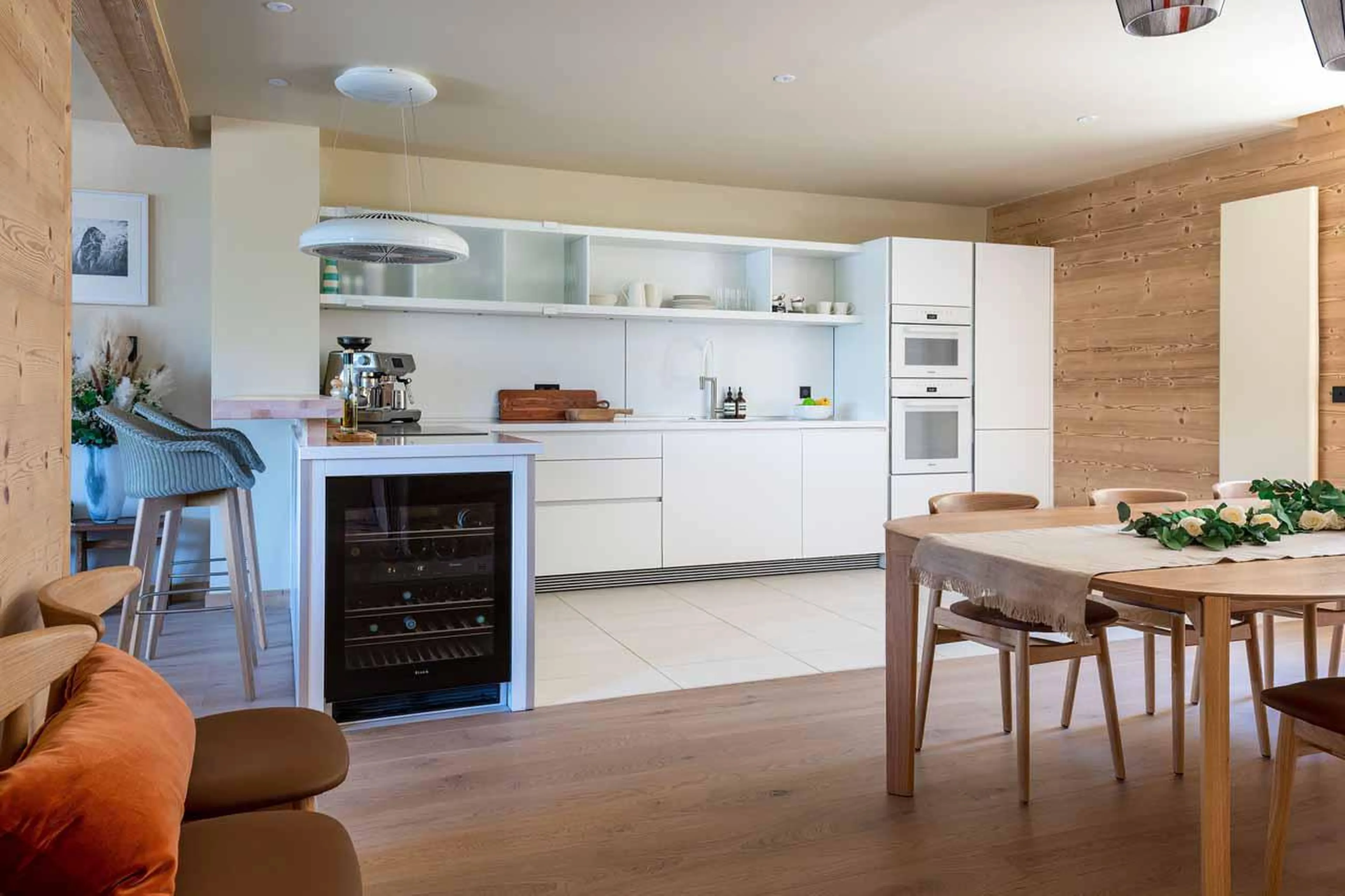 Dining area and kitchen at Chalet Sira in Courchevel 1550