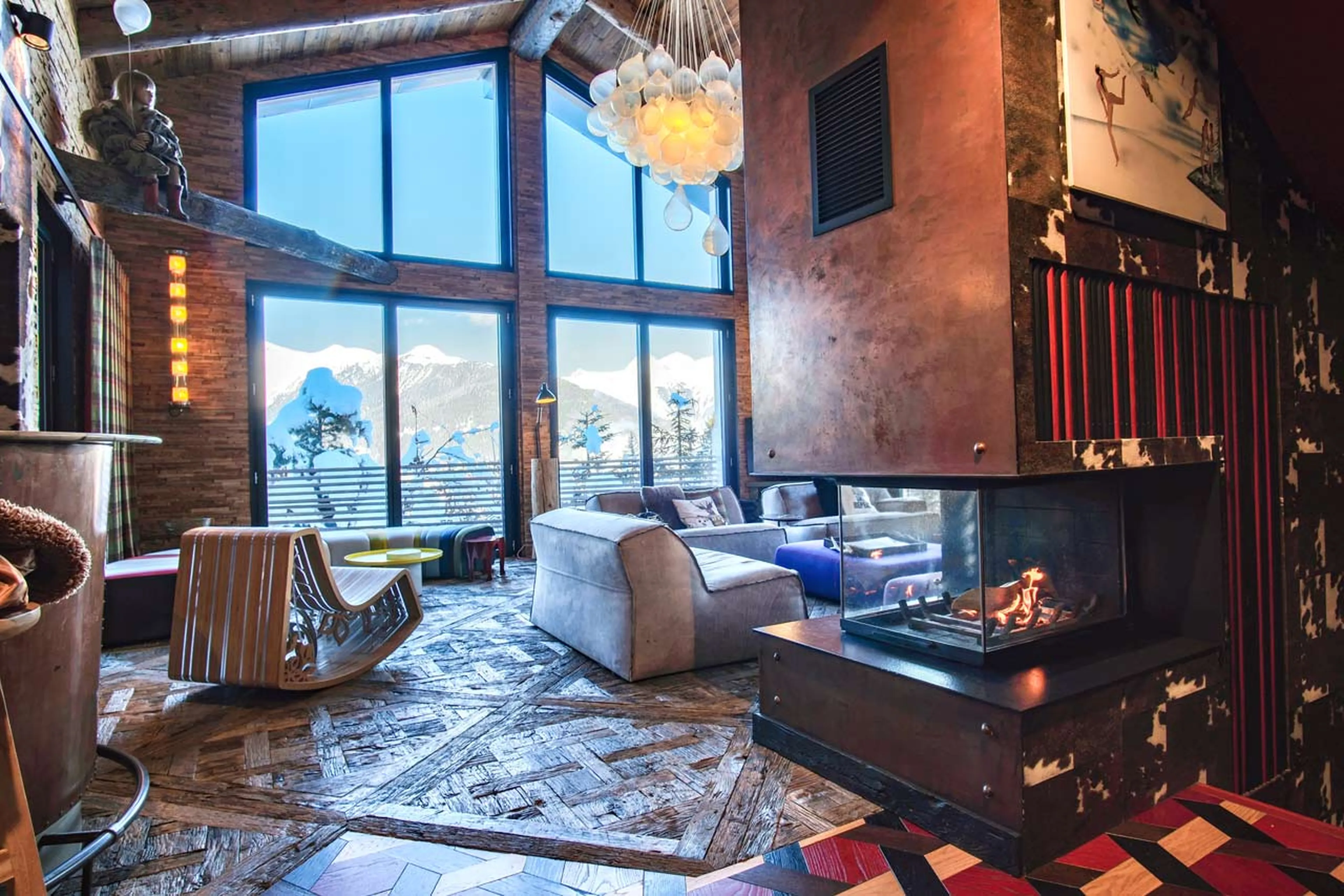 Fireplace and view from living area of Chalet Sisimiut in Courchevel 1550