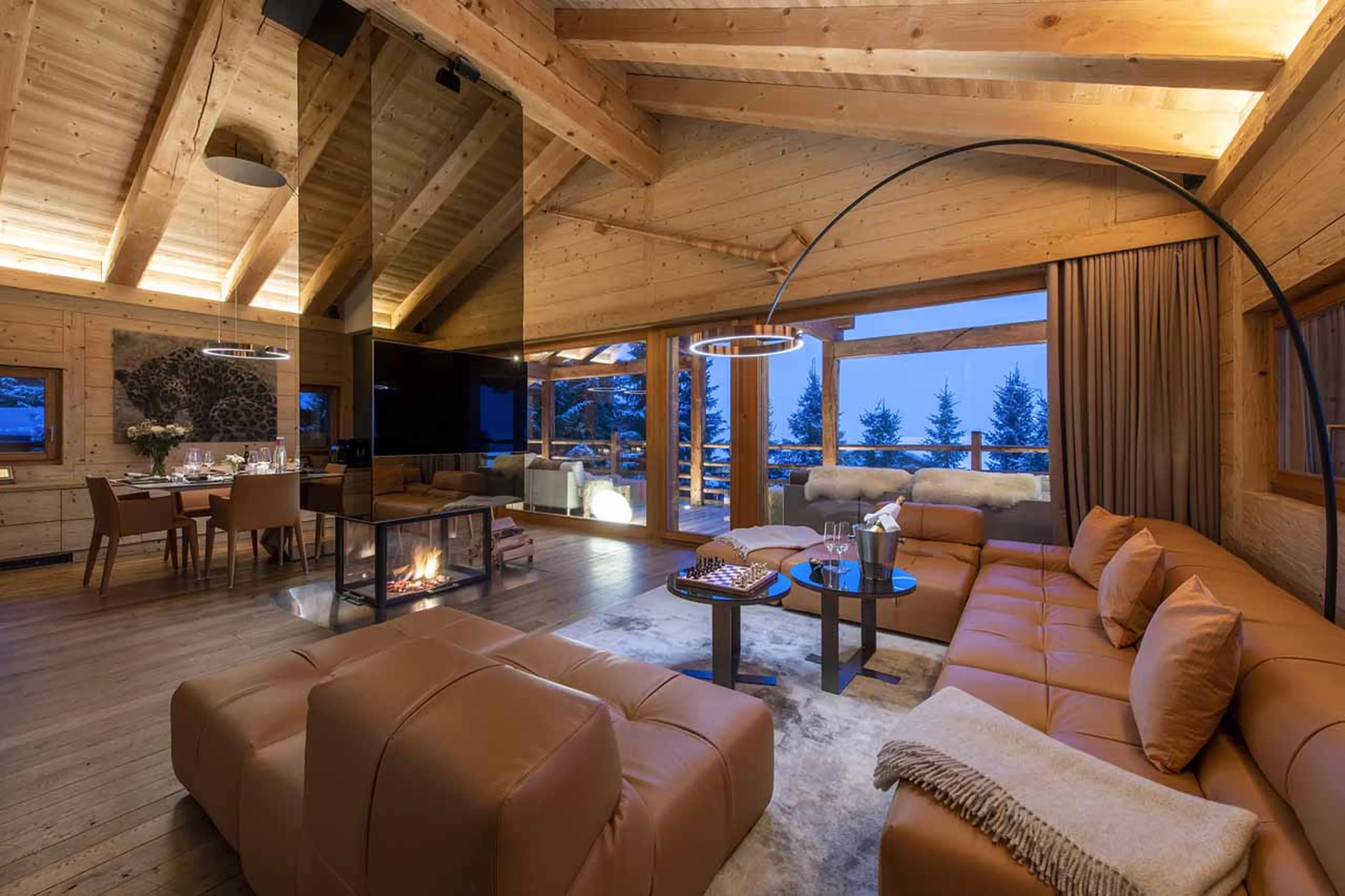 Living area at night at Chalet Spa in Verbier