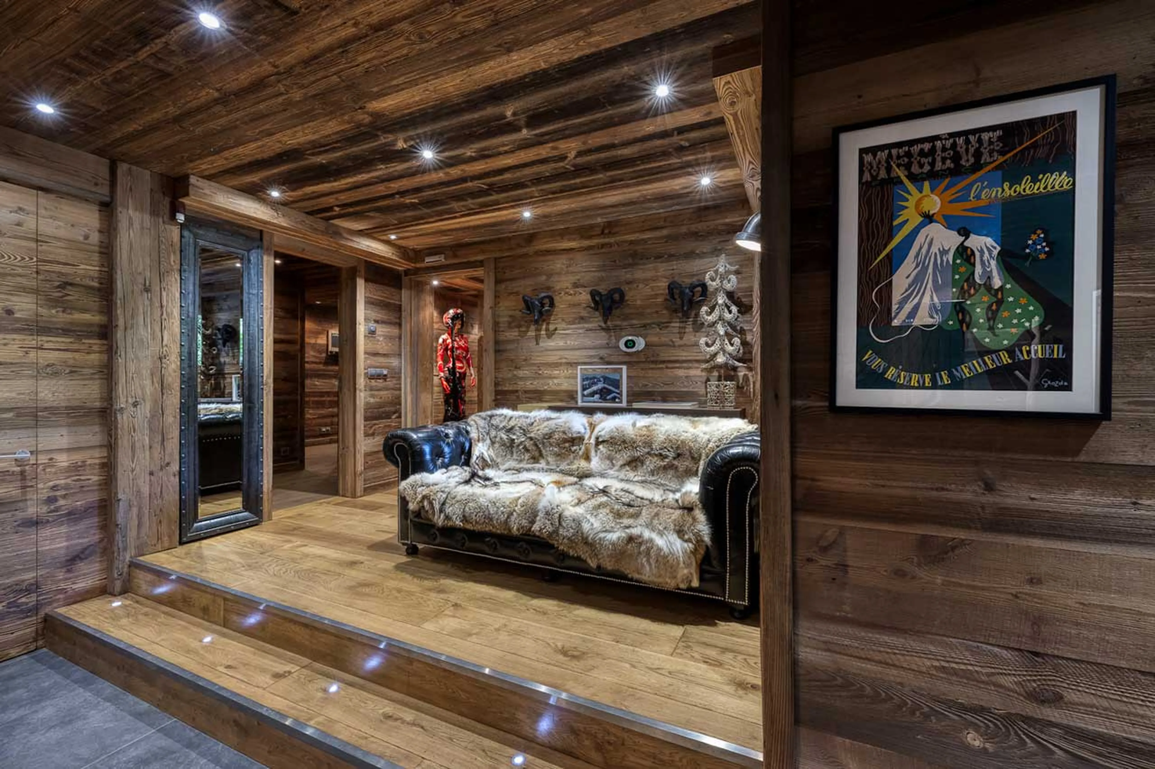 Sofa in entrance to Chalet Talland in Megeve