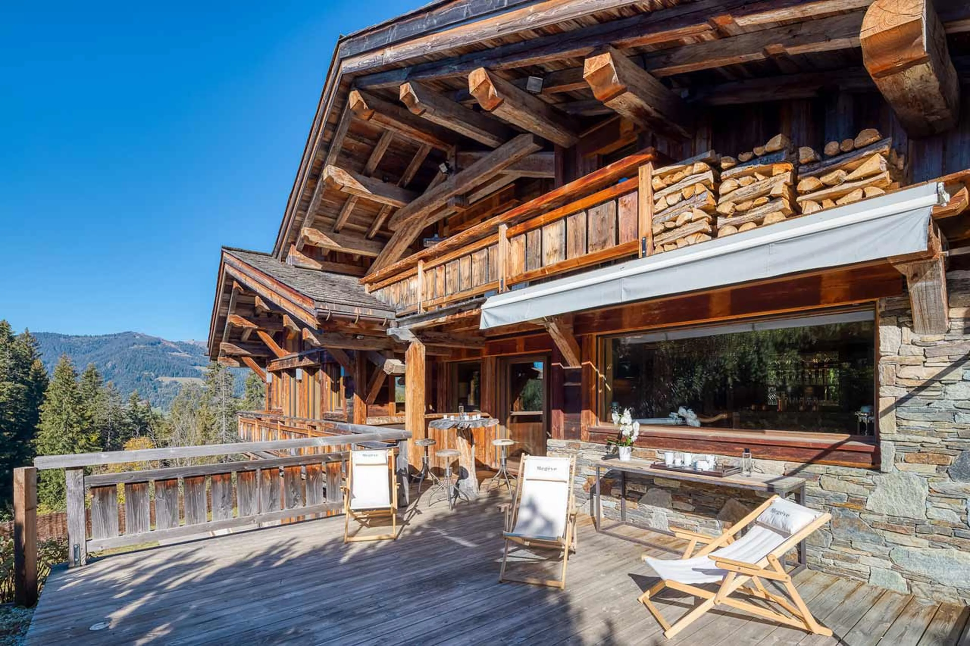 Sun-drenched terrace at Chalet Talland in Megeve