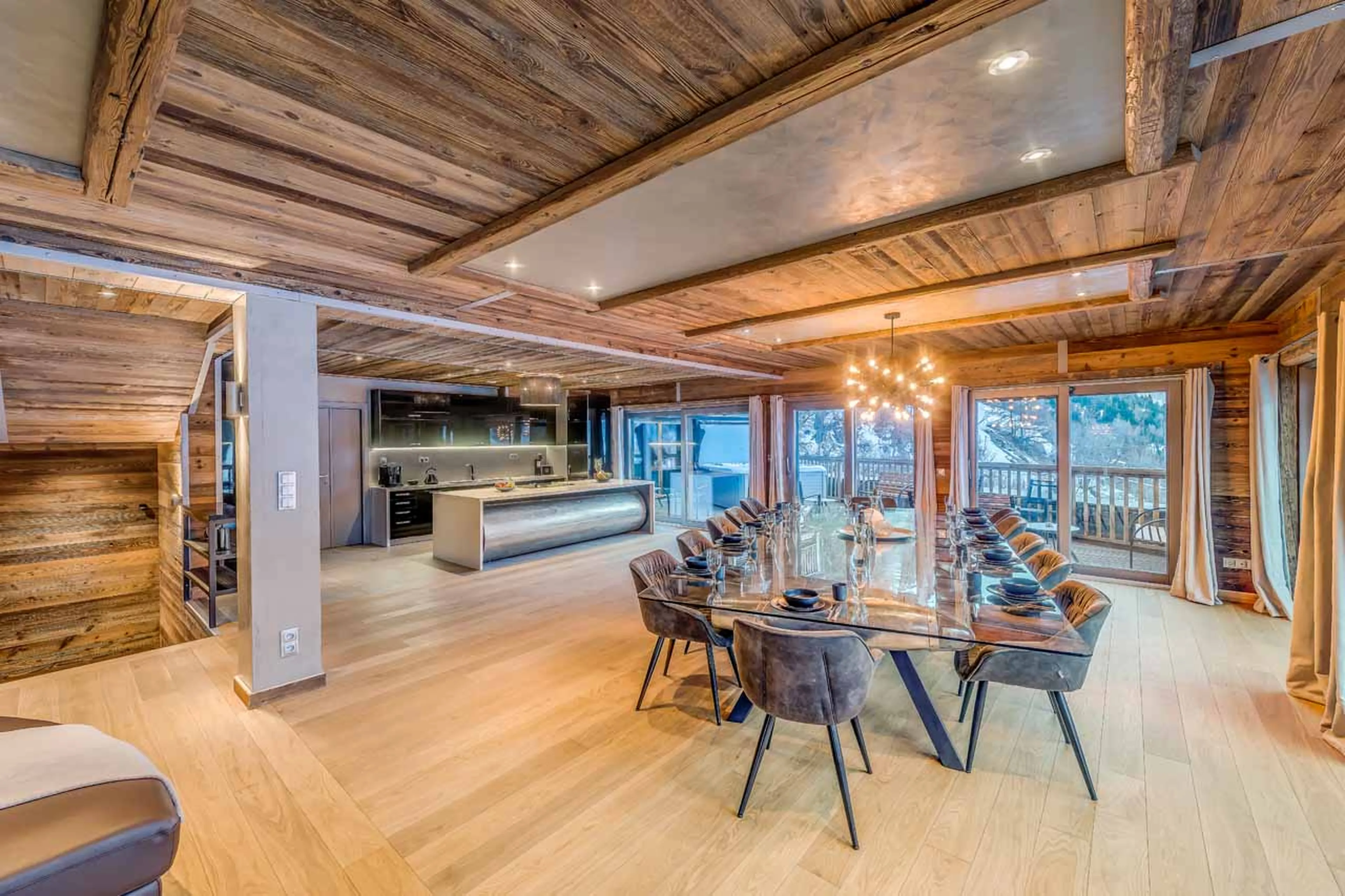 Dining table and kitchen at Chalet Tango in Tignes