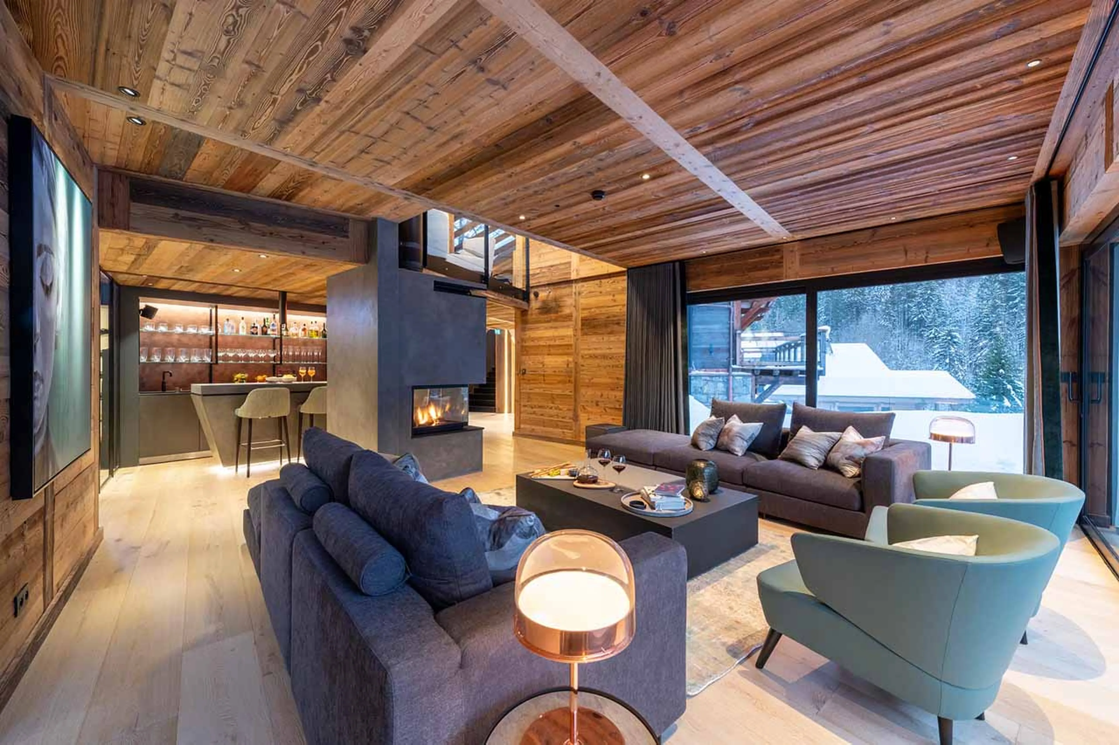 Living room opening onto terrace at Chalet Tataali in Morzine