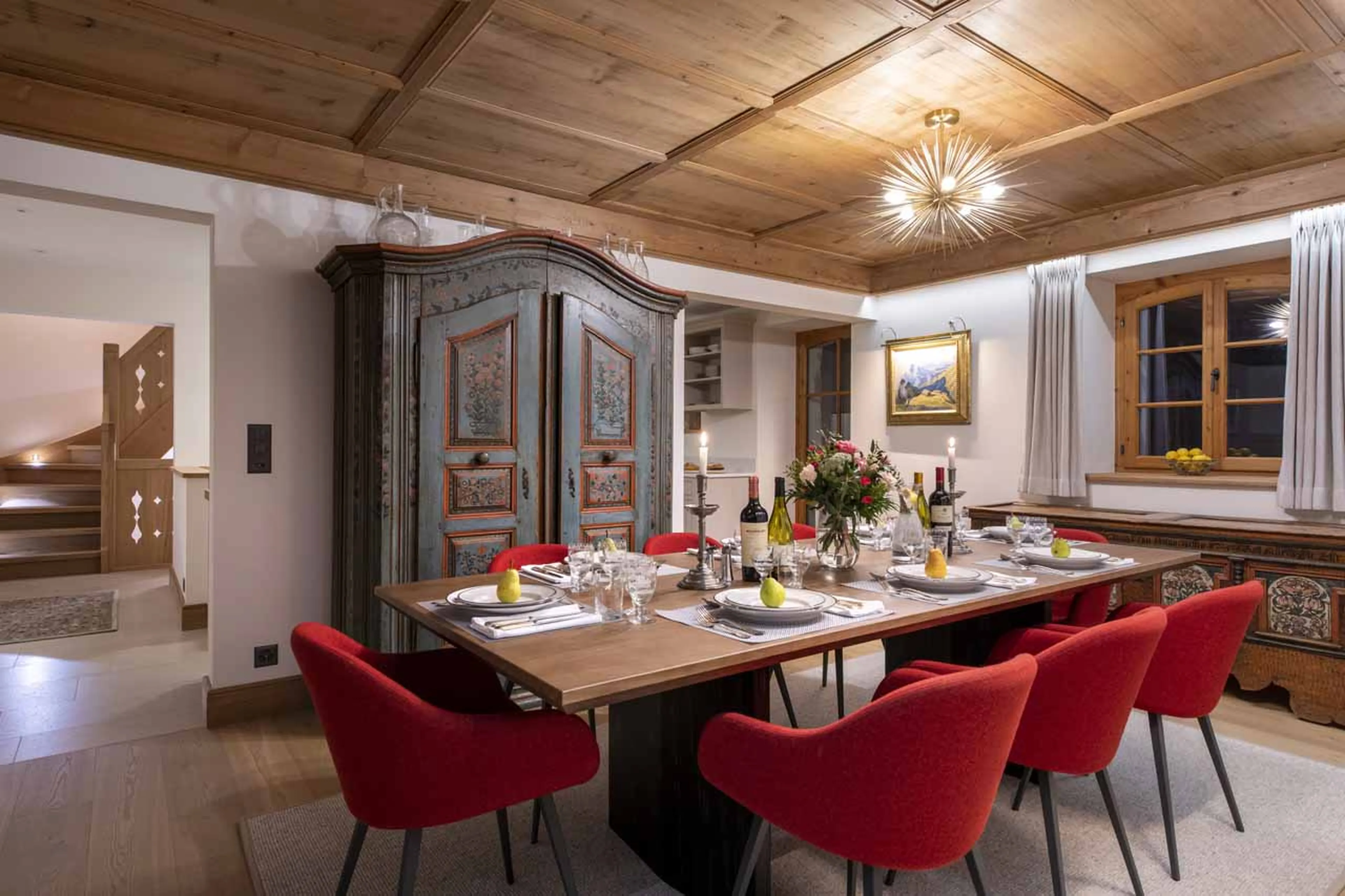Dining room at night at Chalet Tire Bouchon in Verbier
