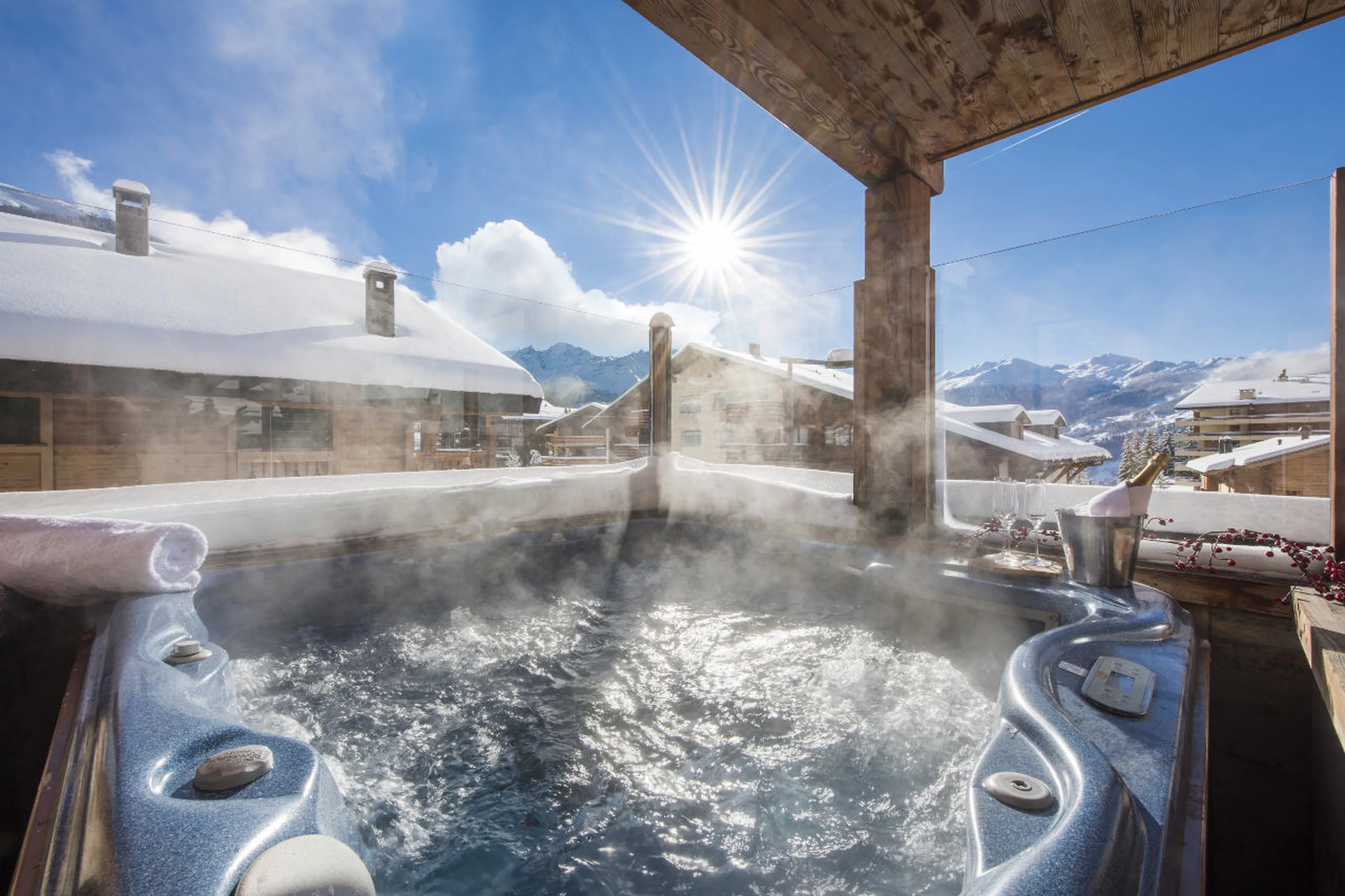 Outdoor hot tub on balcony at Penthouse Treize Etoiles in Verbier