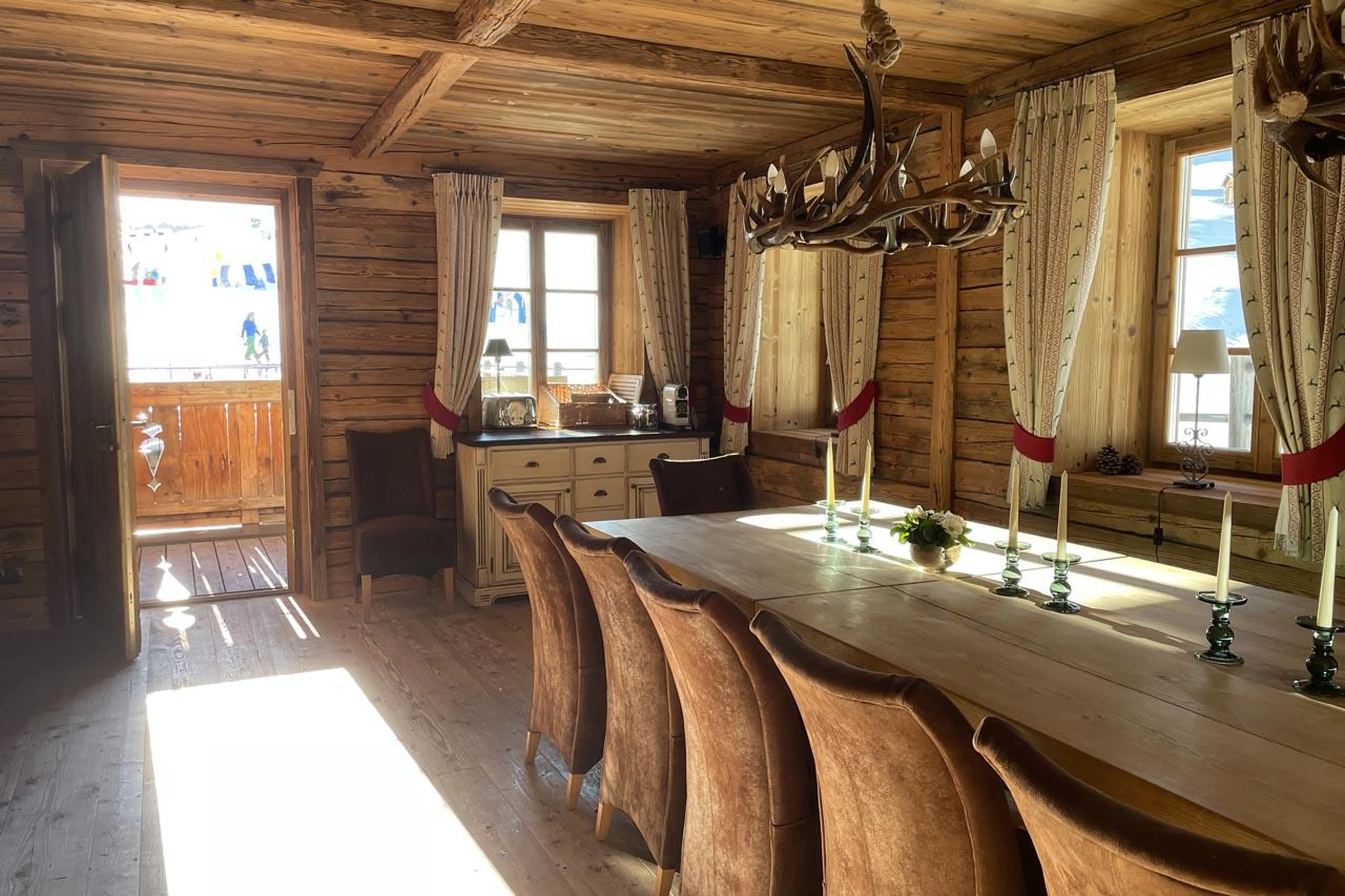 Dining room opening out onto terrace at Chalet Tschoder in St Anton