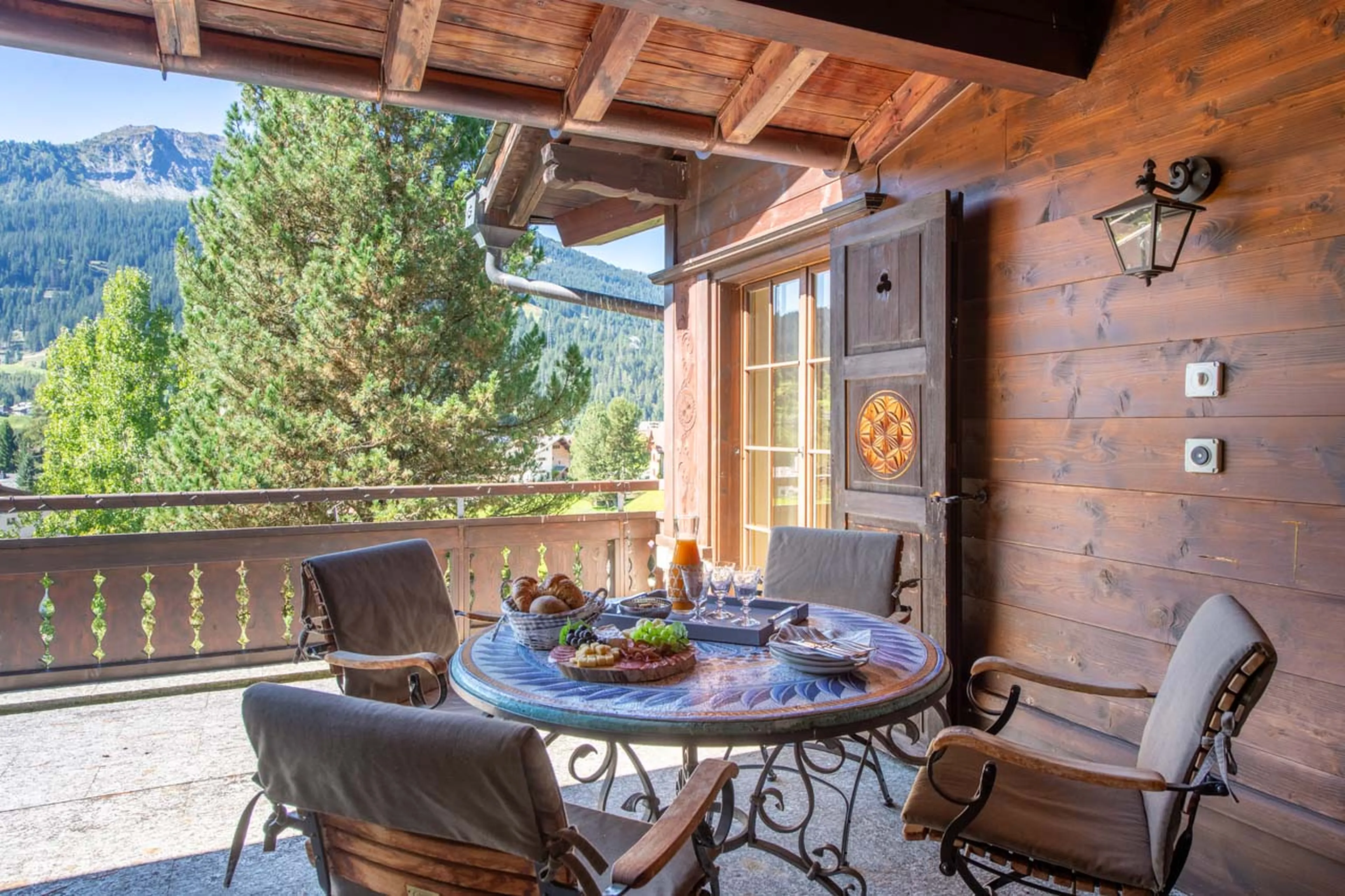 Table on terrace at Chalet Tschuetta in Klosters