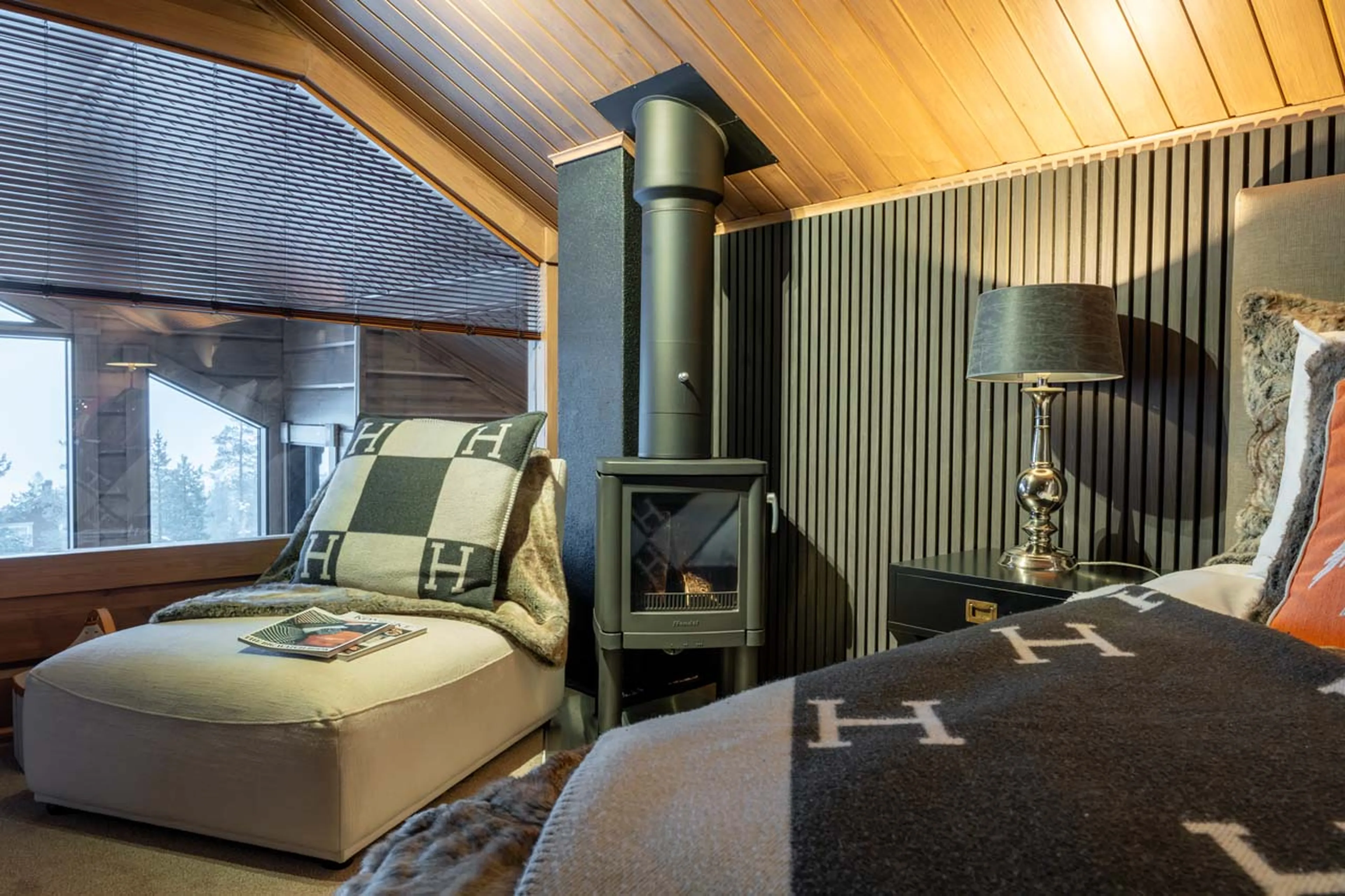 Wood burner in master suite at Chalet Utsu in Levi, Finland