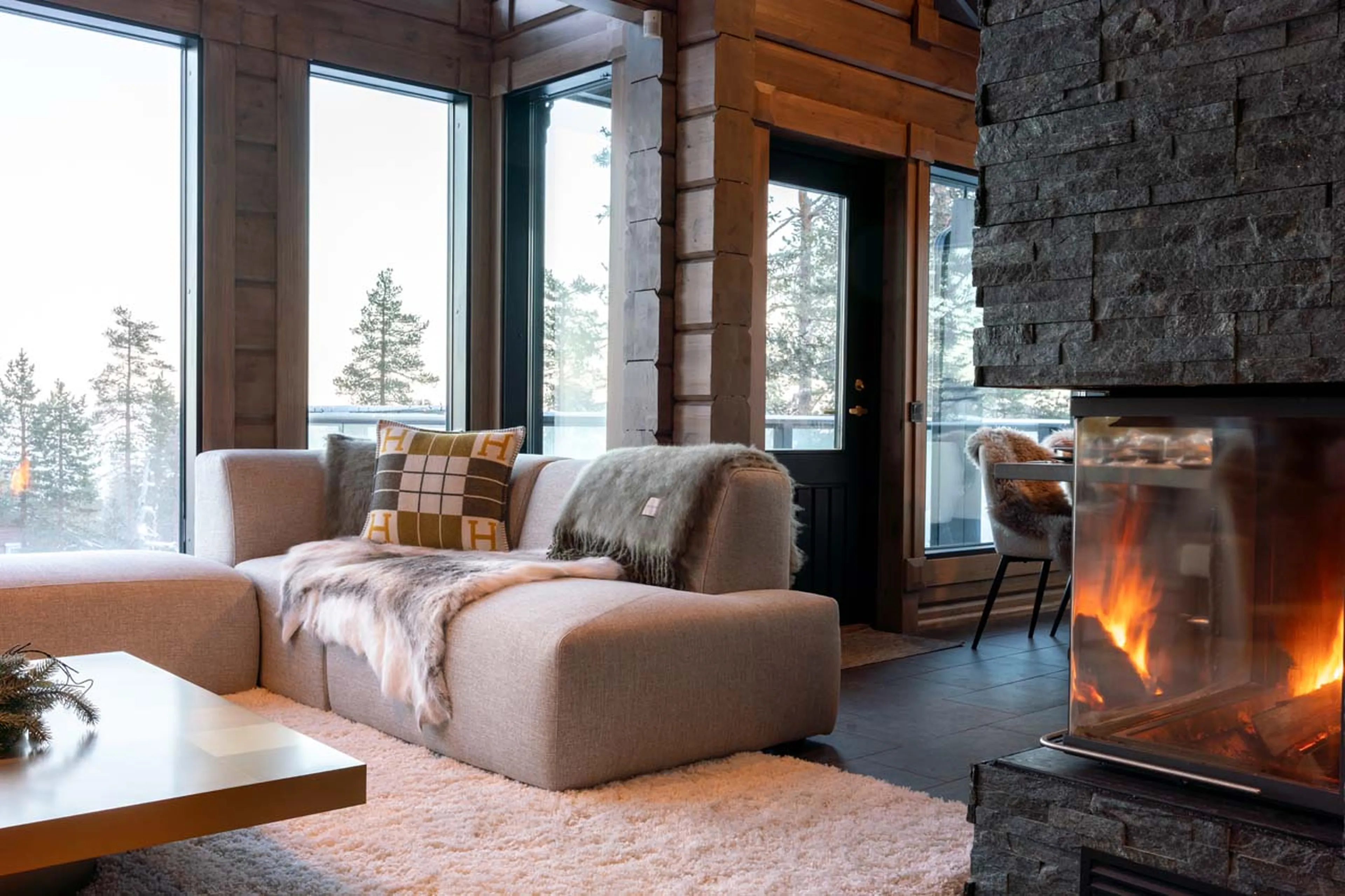 Living area with fireplace at Chalet Utsu in Levi, Finland