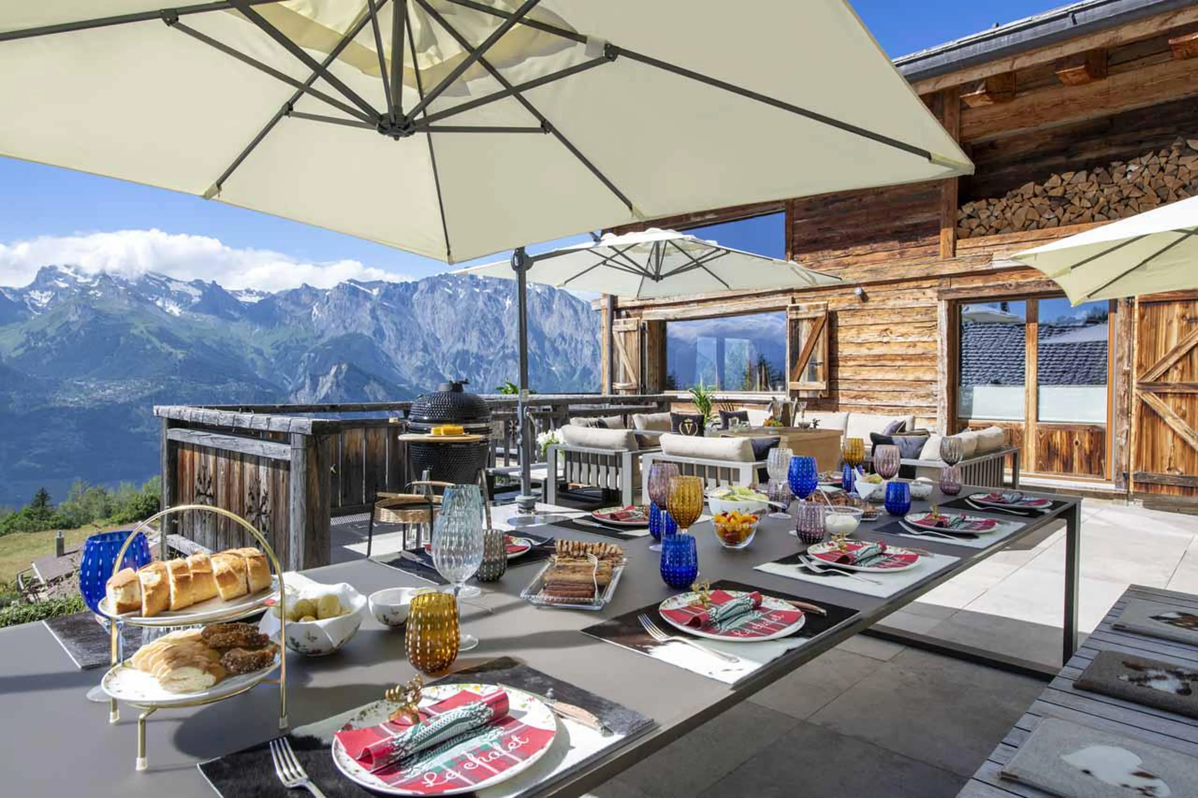 Al fresco dining on terrace in summer at Chalet V in La Tzoumaz